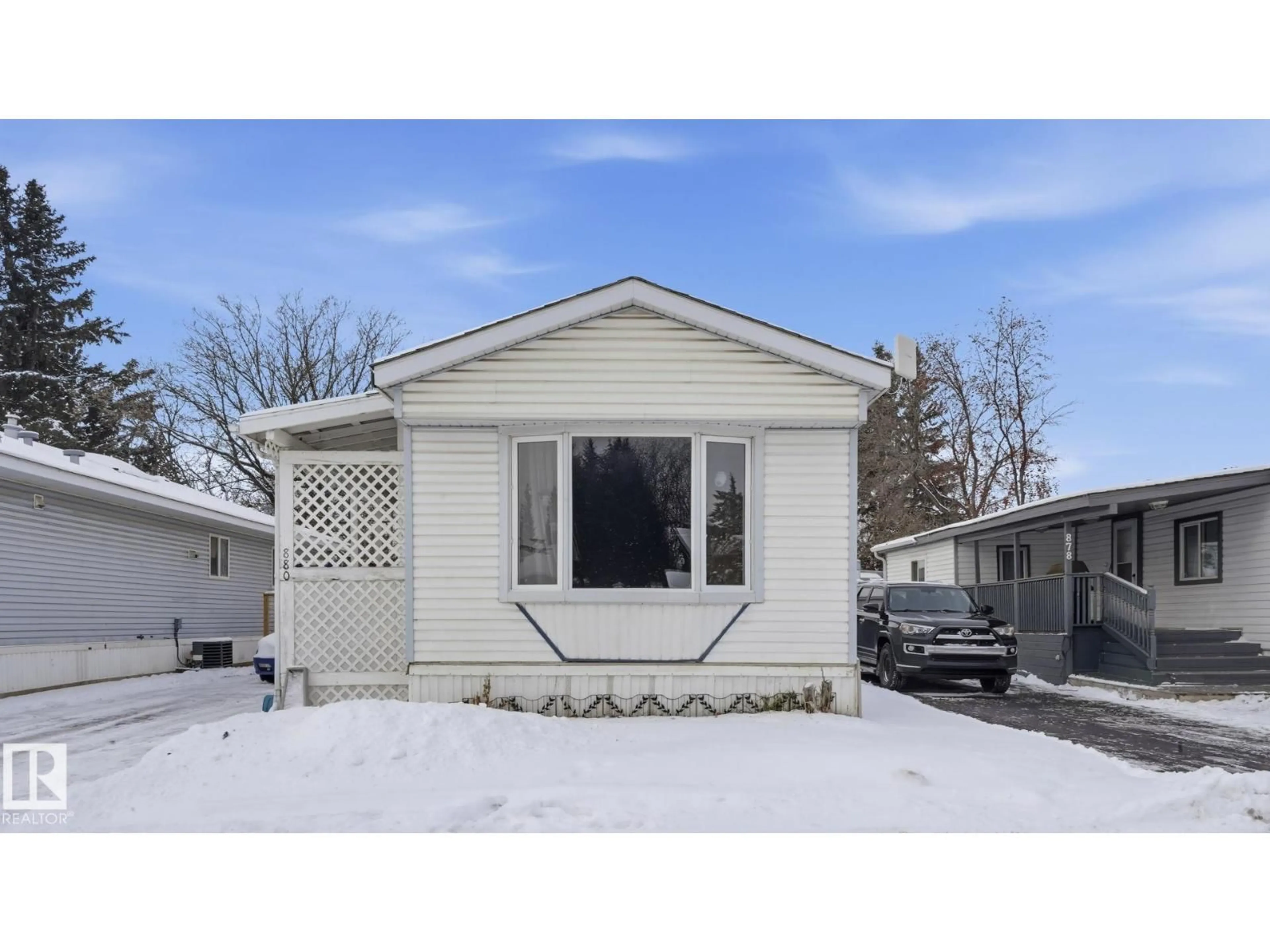 Home with vinyl exterior material, street for 880 WEST COAST BAY NW, Edmonton Alberta T5S1T7