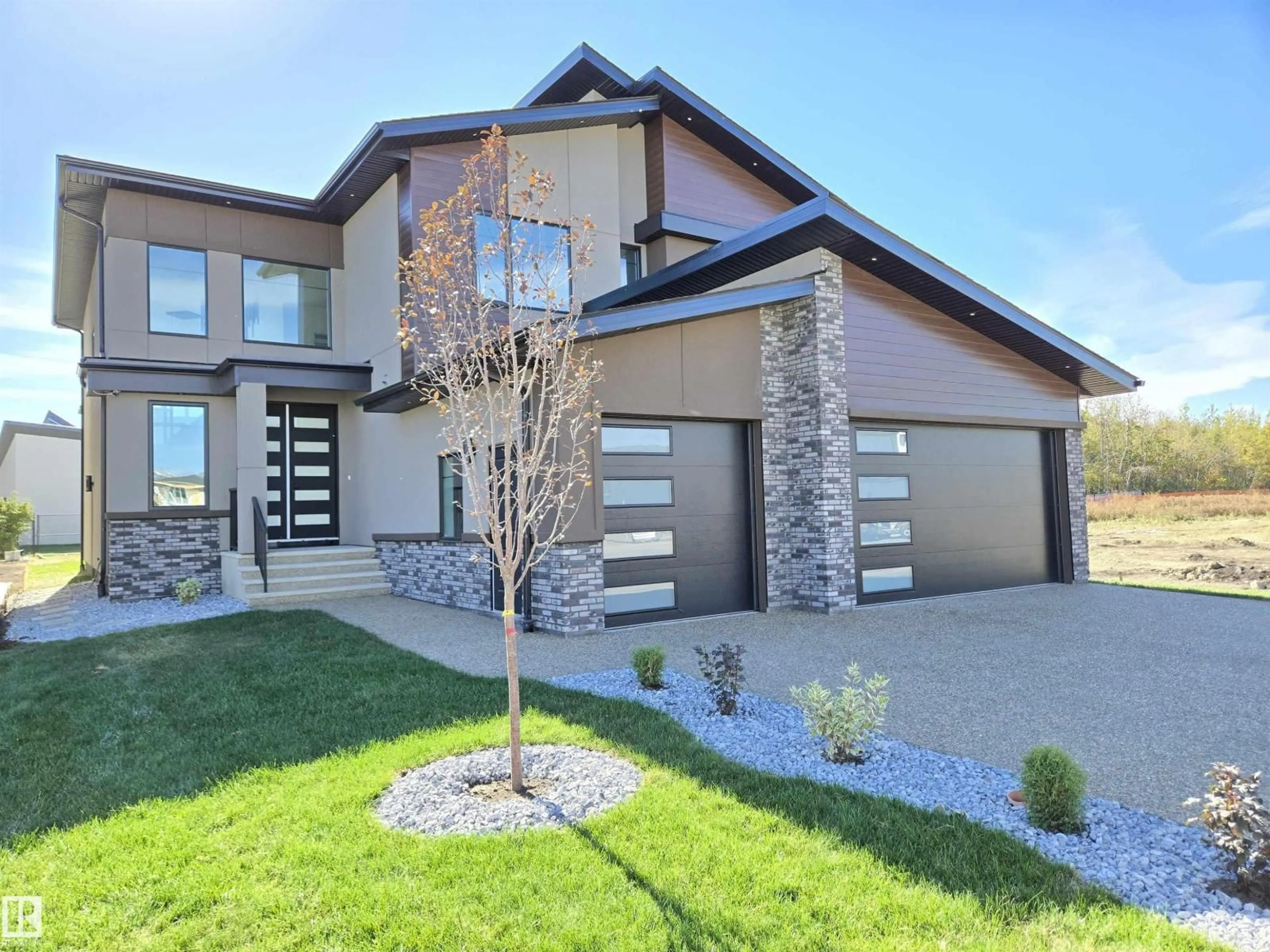 Home with brick exterior material, street for 715 165 AV, Edmonton Alberta T5Y4J1