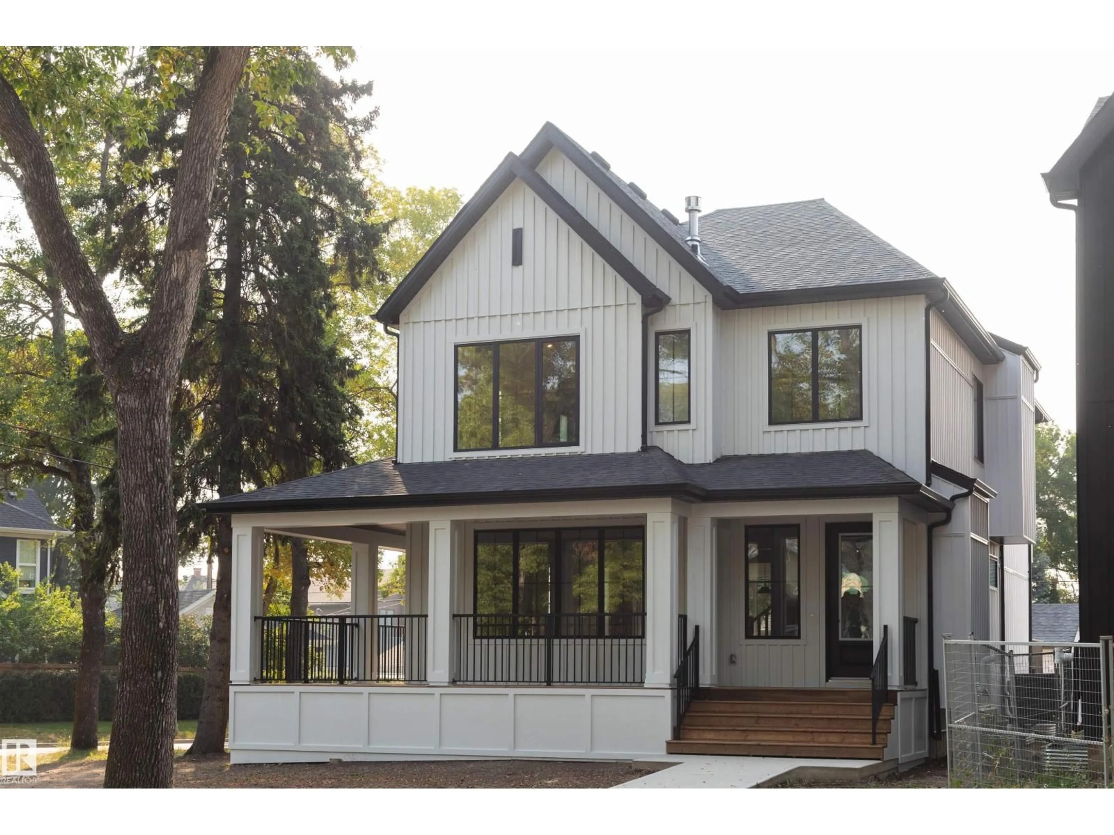 Home with vinyl exterior material, street for 6003 111 AV, Edmonton Alberta T5W0L1