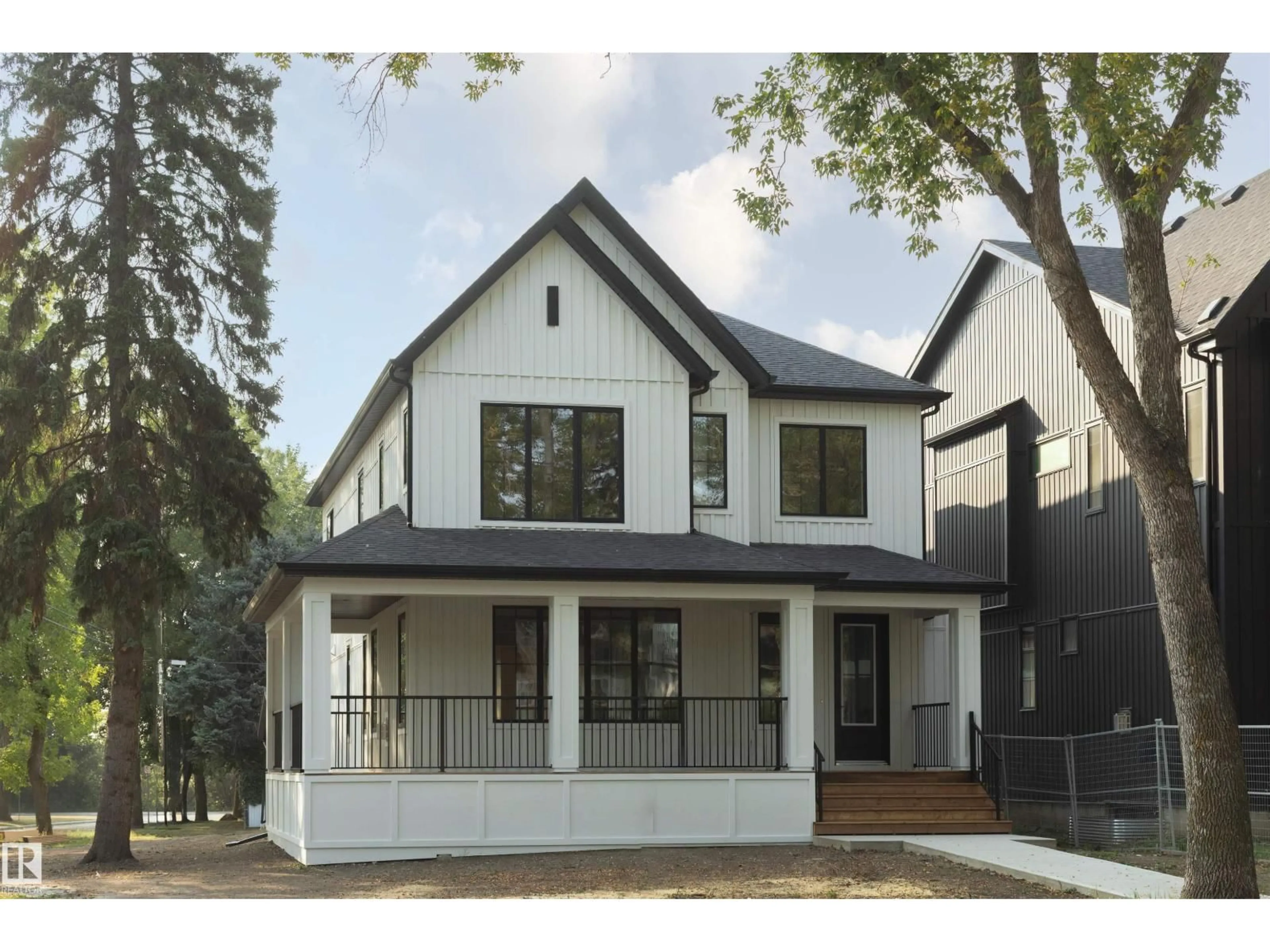 Home with vinyl exterior material, street for 6003 111 AV, Edmonton Alberta T5W0L1