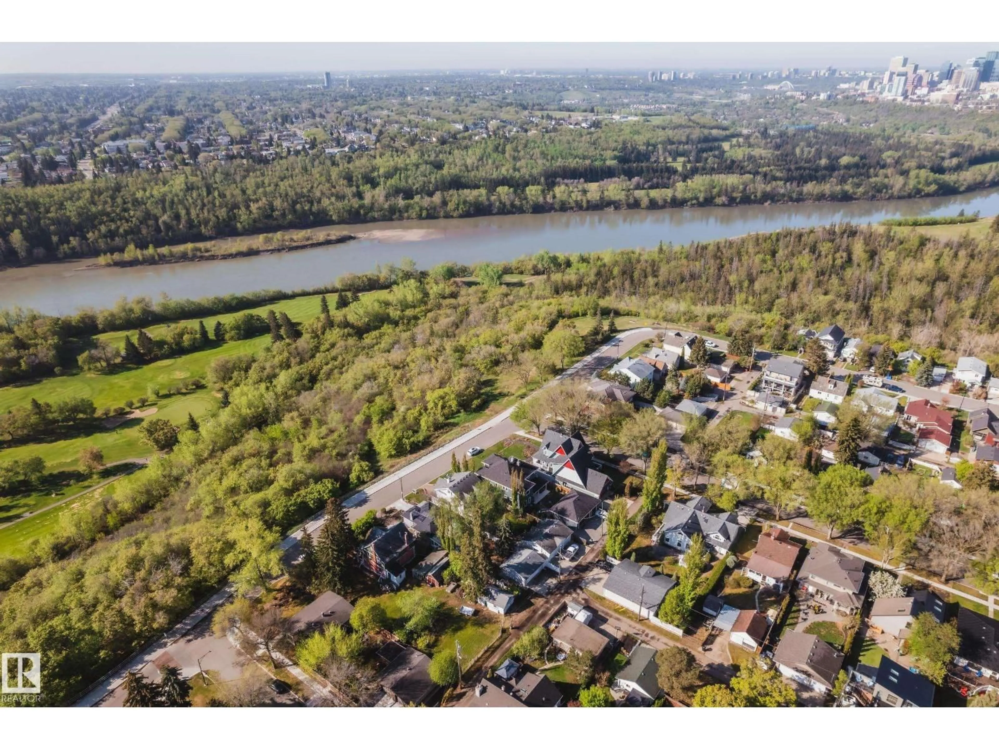 A pic from outside/outdoor area/front of a property/back of a property/a pic from drone, water/lake/river/ocean view for 6003 111 AV, Edmonton Alberta T5W0L1