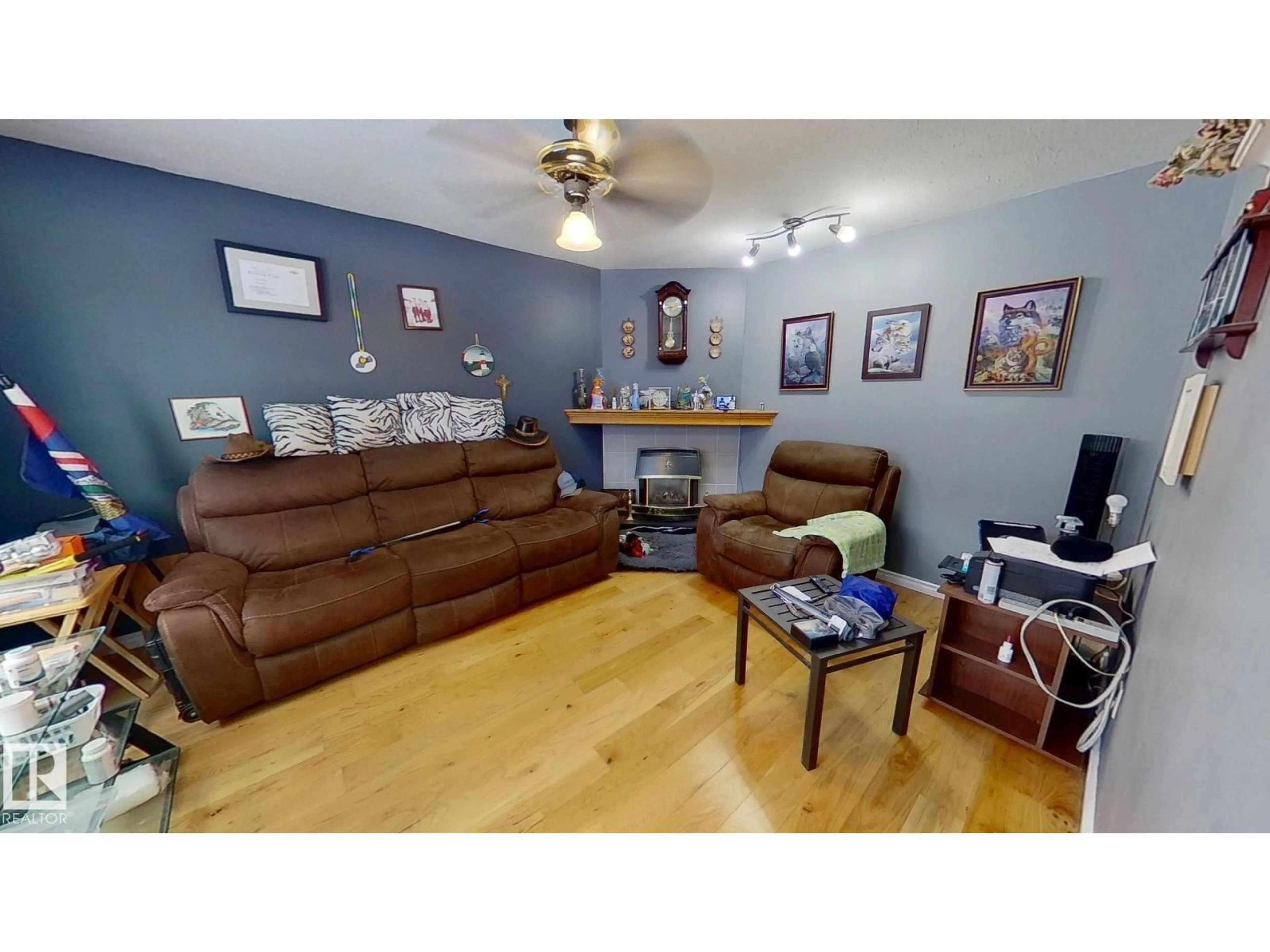 Living room with furniture, wood/laminate floor for 4710 56 AV, Bruderheim Alberta T0B0S0