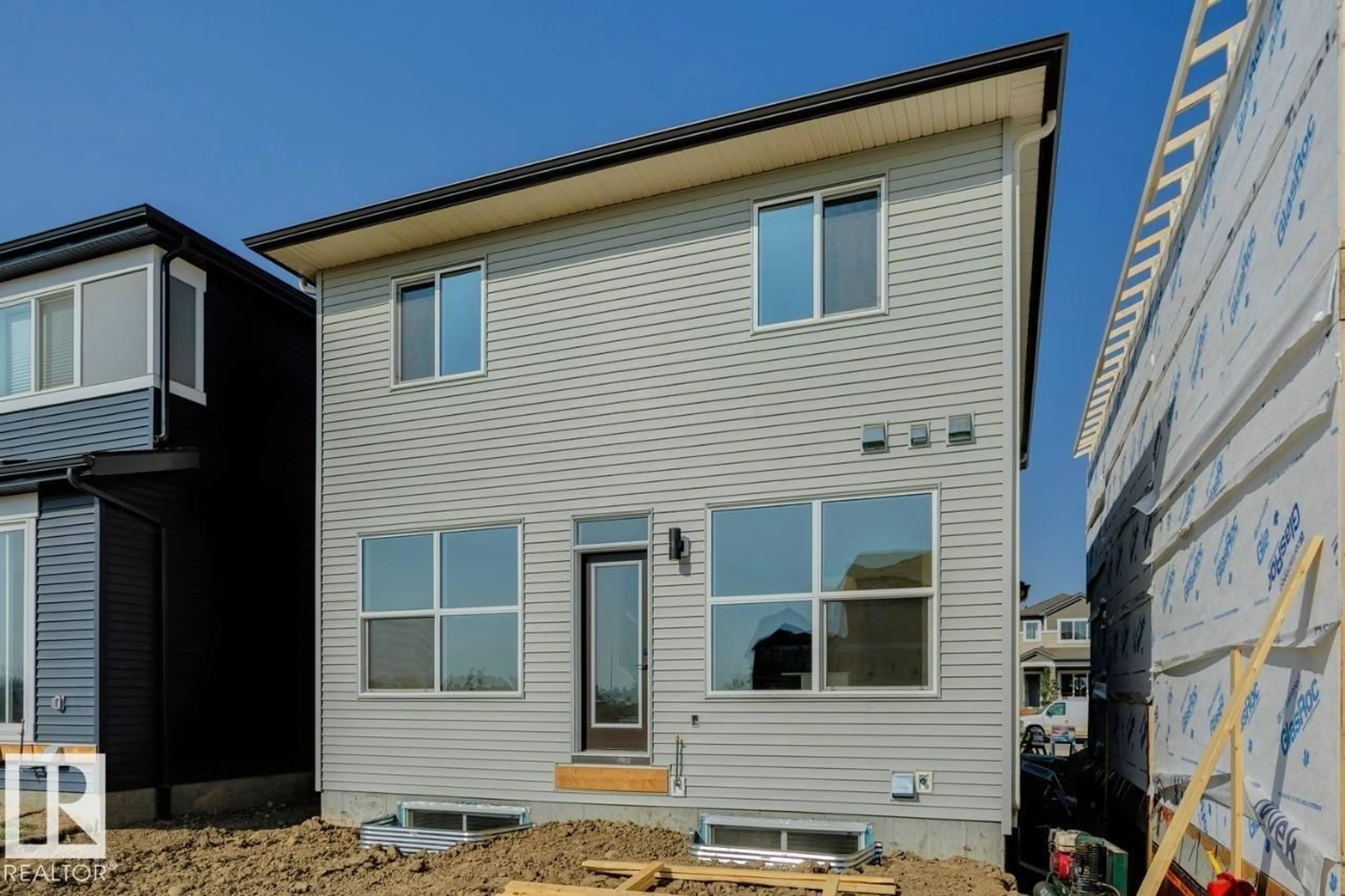 Home with vinyl exterior material, street for 7113 51 AV, Beaumont Alberta T4X3E5
