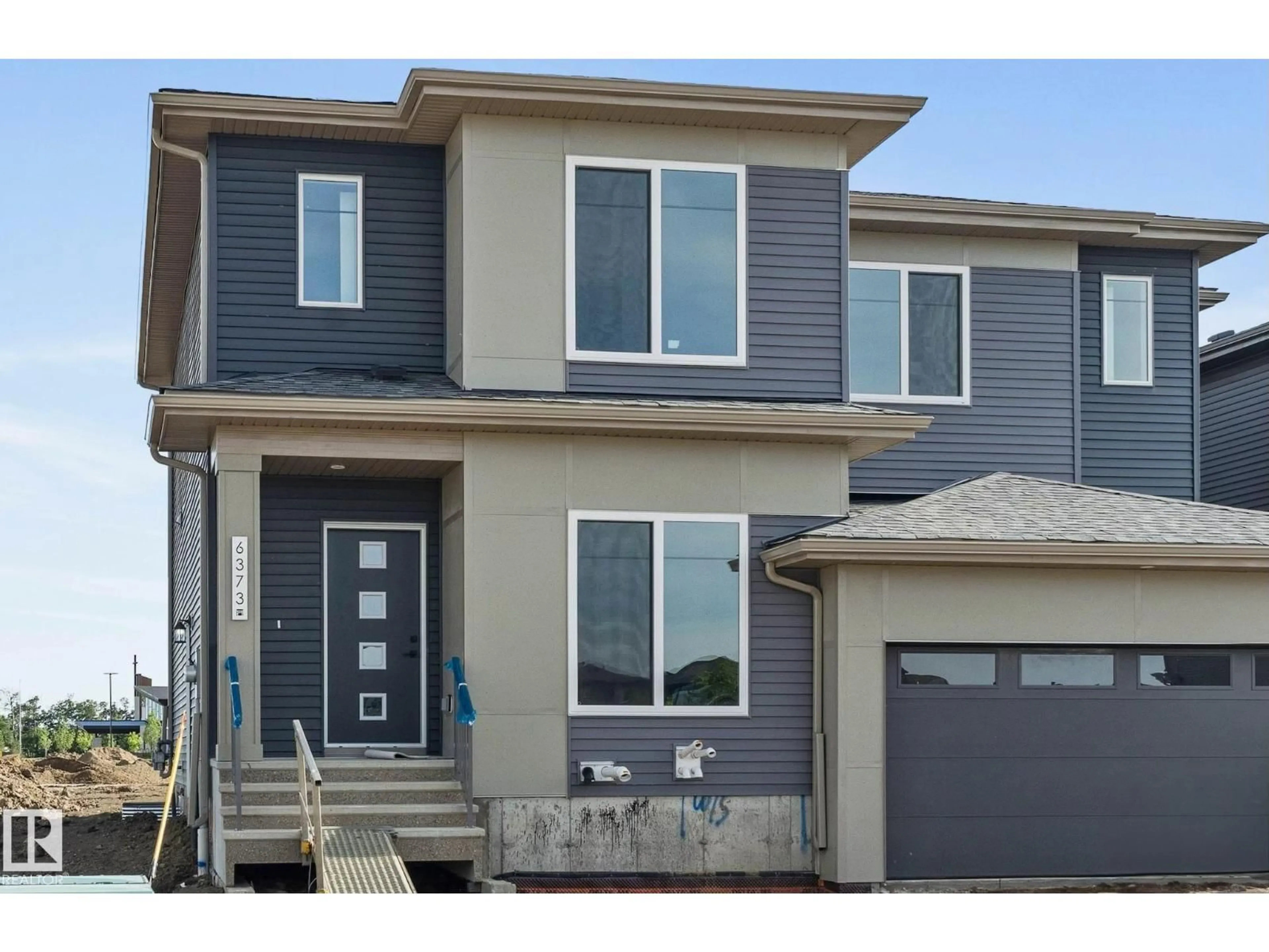 Home with vinyl exterior material, street for SW - 6373 KING WD, Edmonton Alberta T6W5J3