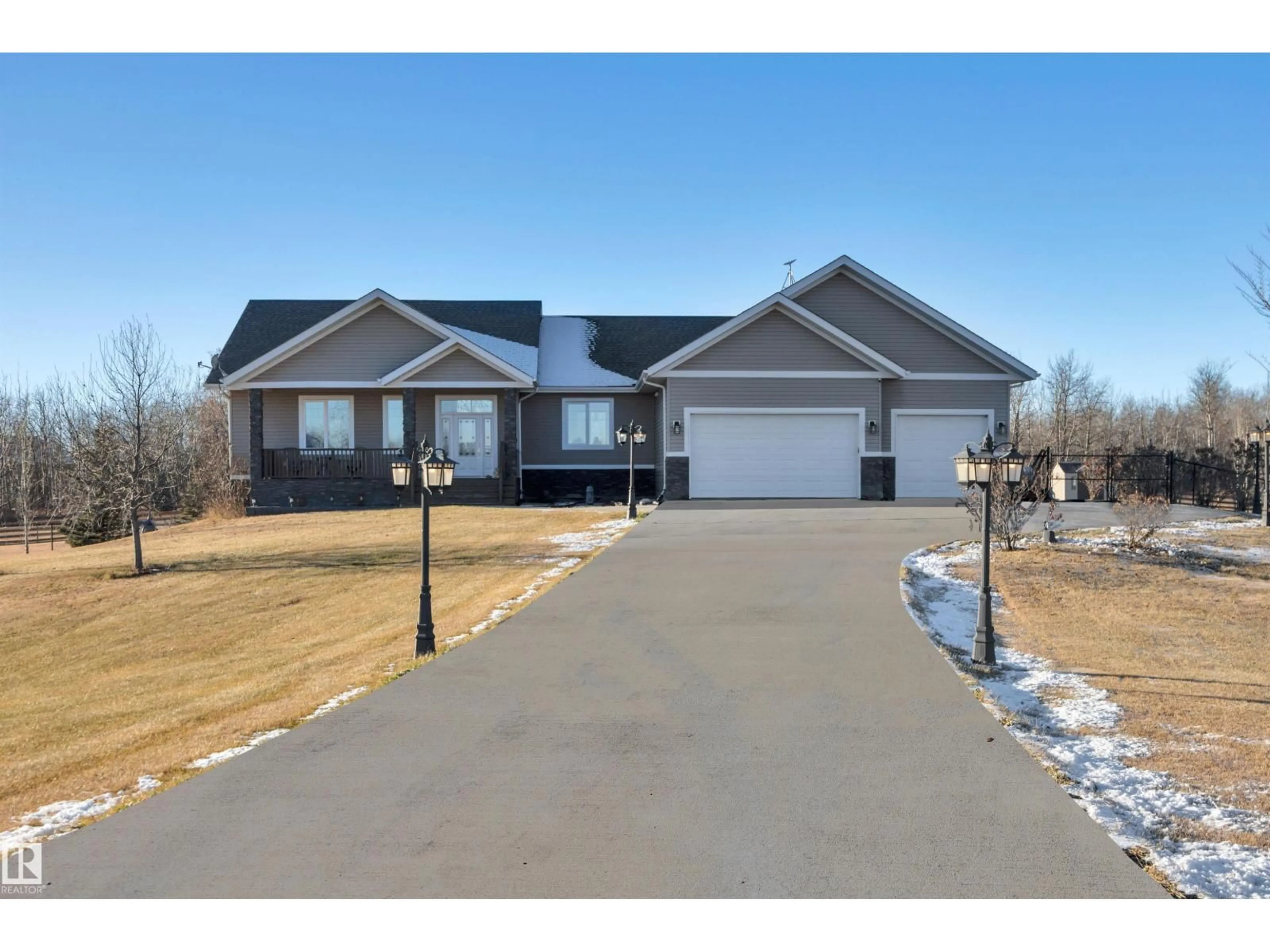 Home with vinyl exterior material, street for 540 50450 RGE RD 234, Rural Leduc County Alberta T4X0L7
