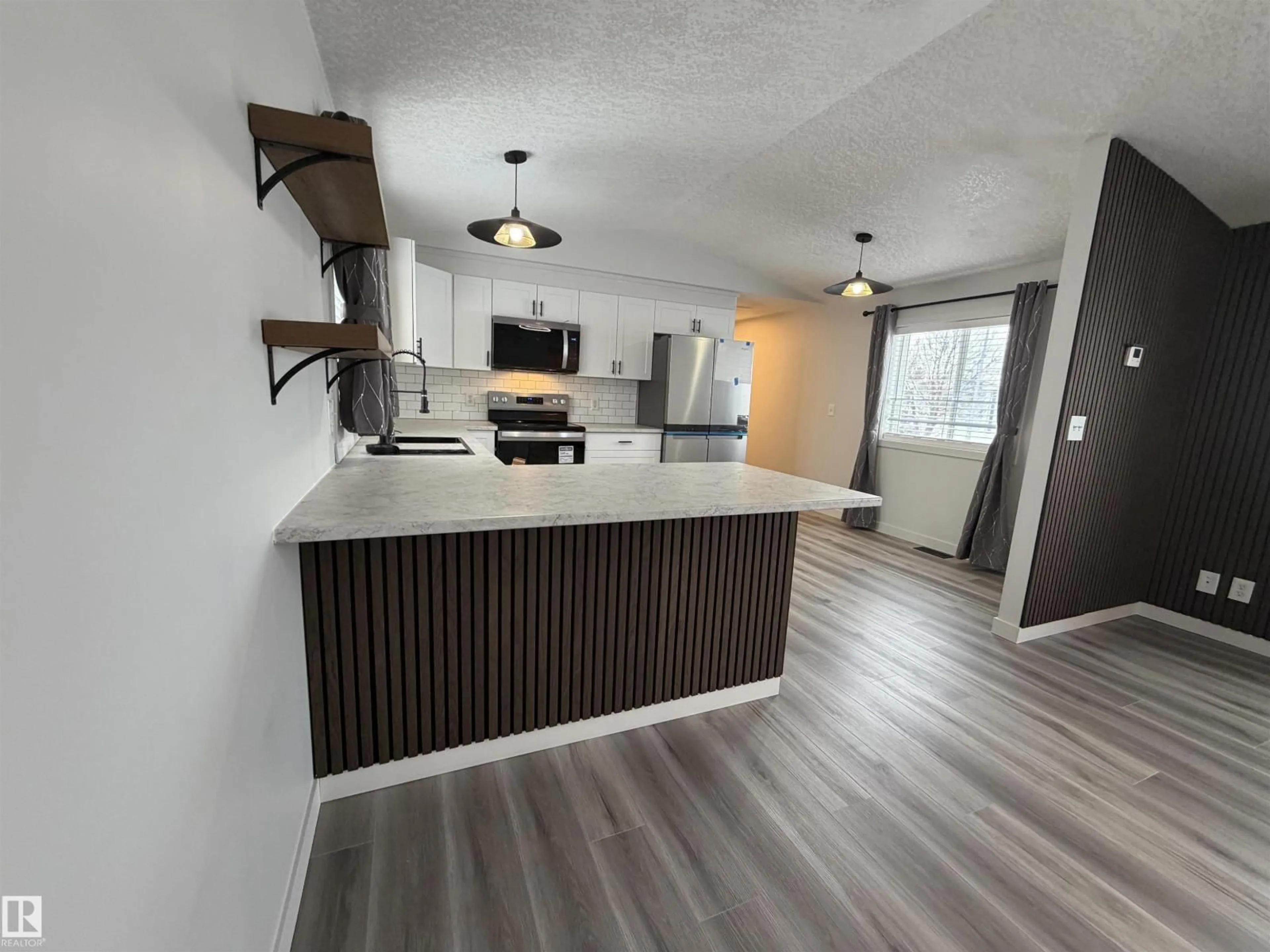 Open concept kitchen, wood/laminate floor for 1613 JUBILEE CRESCENT, Sherwood Park Alberta T8H2J3