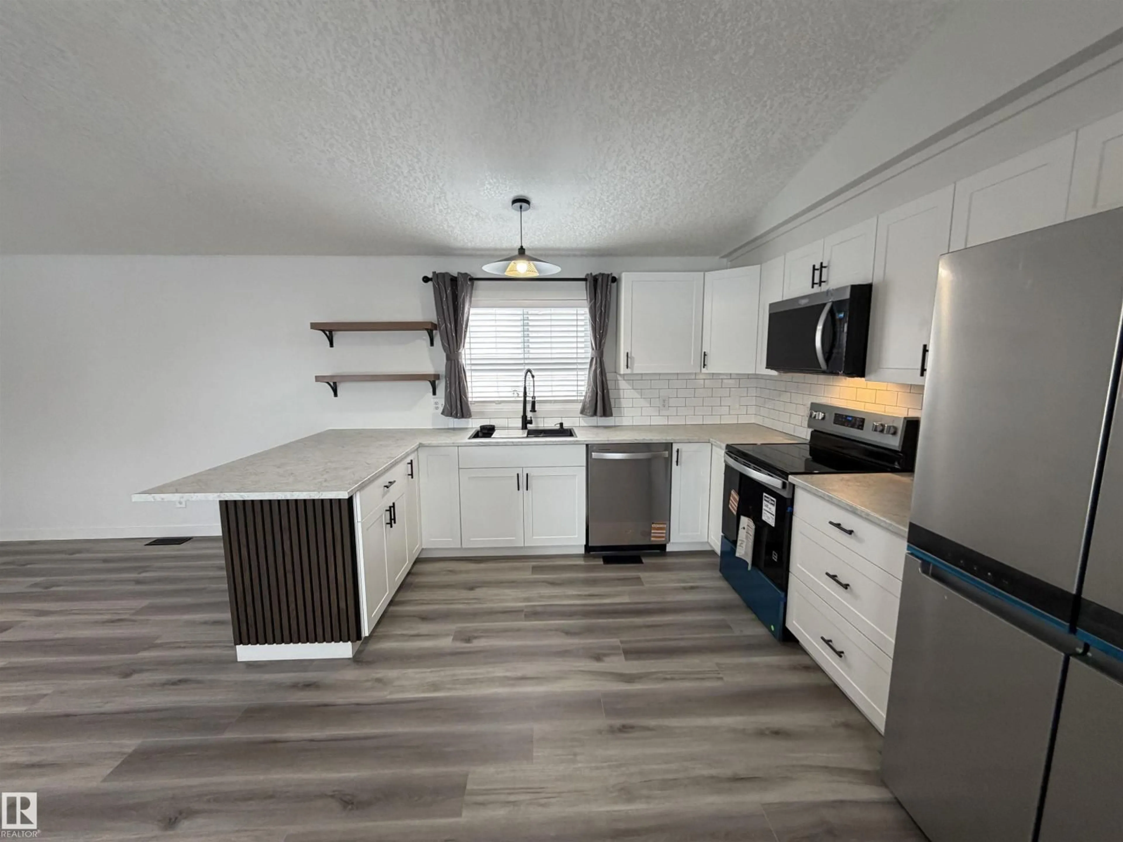 Open concept kitchen, wood/laminate floor for 1613 JUBILEE CRESCENT, Sherwood Park Alberta T8H2J3