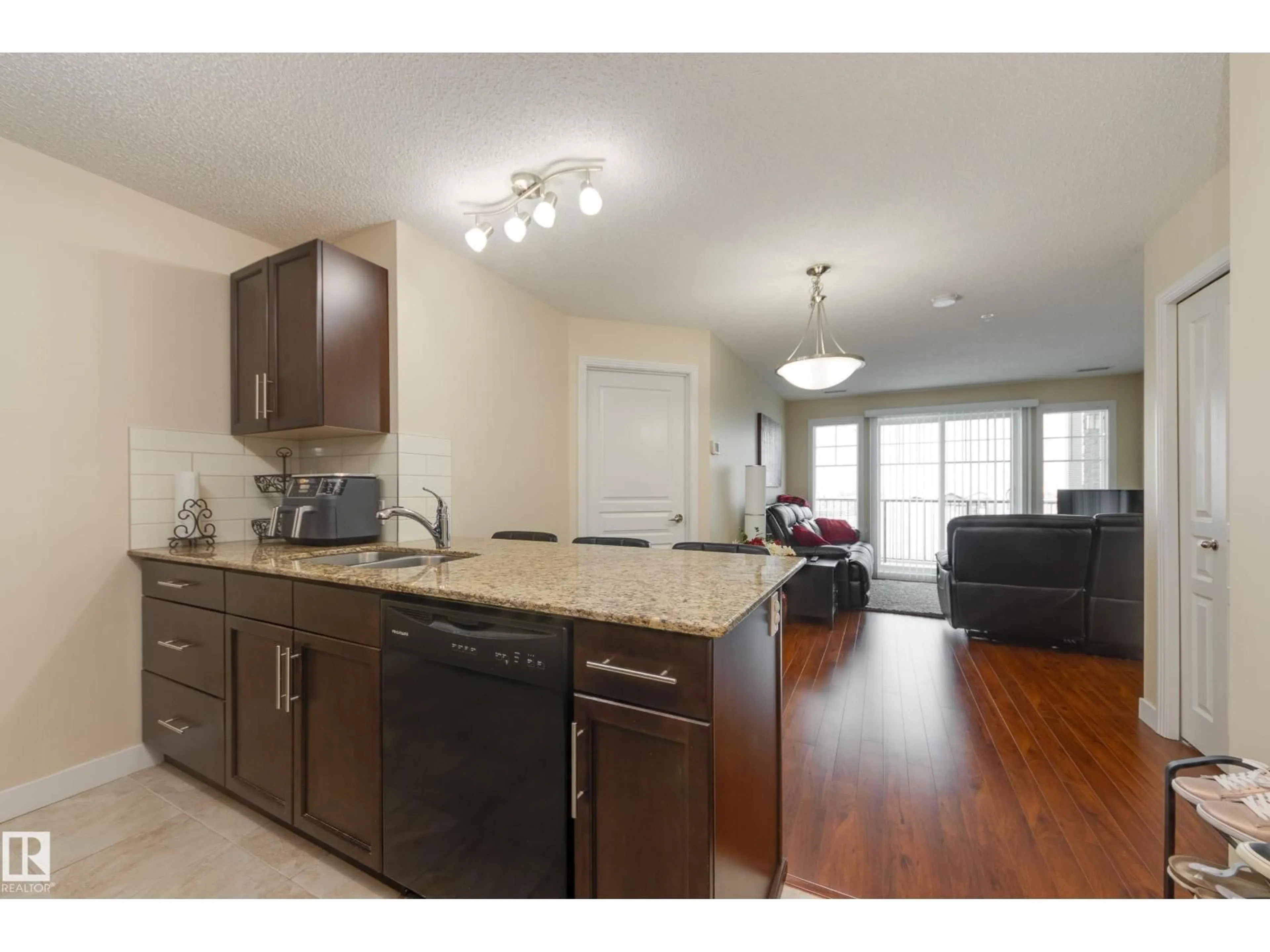 Open concept kitchen, wood/laminate floor for #2216 - 2216 AUGUSTINE CR, Sherwood Park Alberta T8H0X8