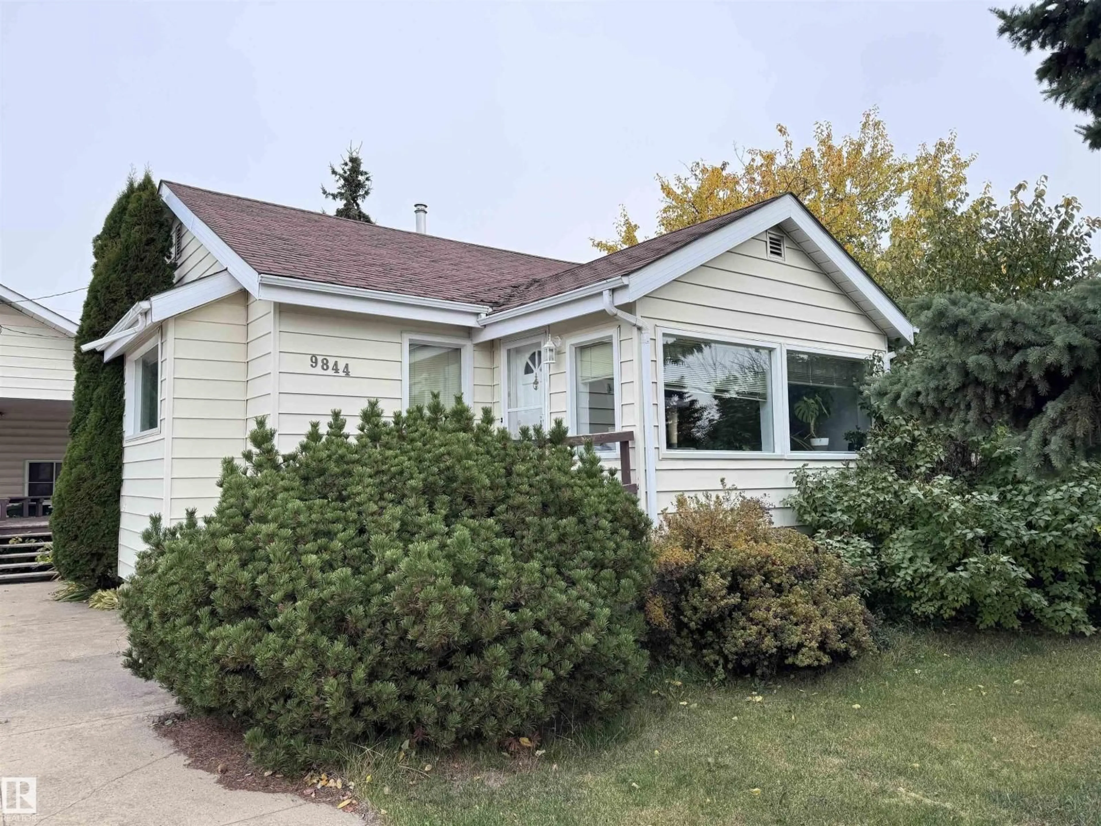 Home with vinyl exterior material, street for 9844 99 ST, Westlock Alberta T7P1Y7