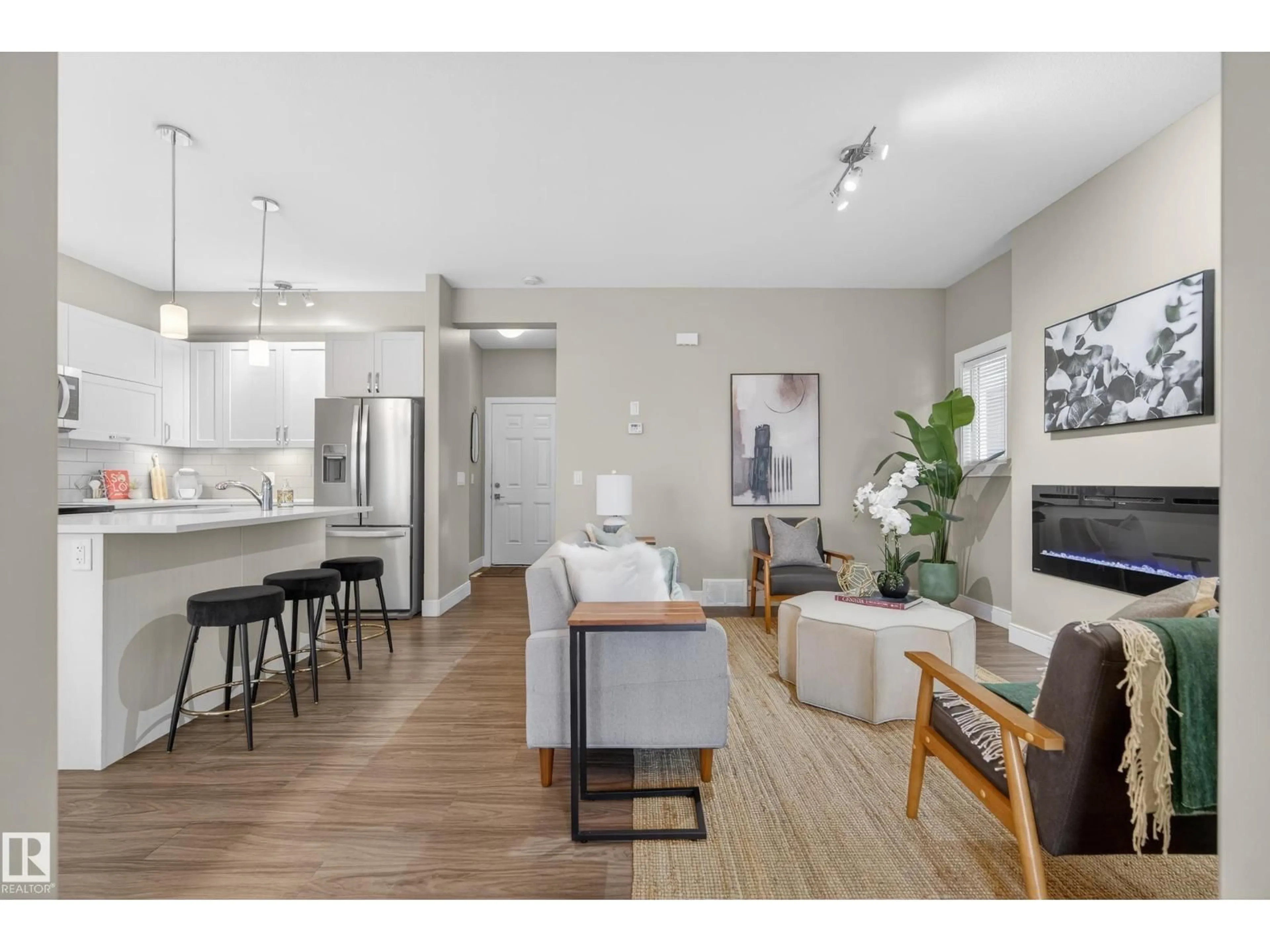 Open concept kitchen, wood/laminate floor for 13149 132 ST NW, Edmonton Alberta T5L1R6