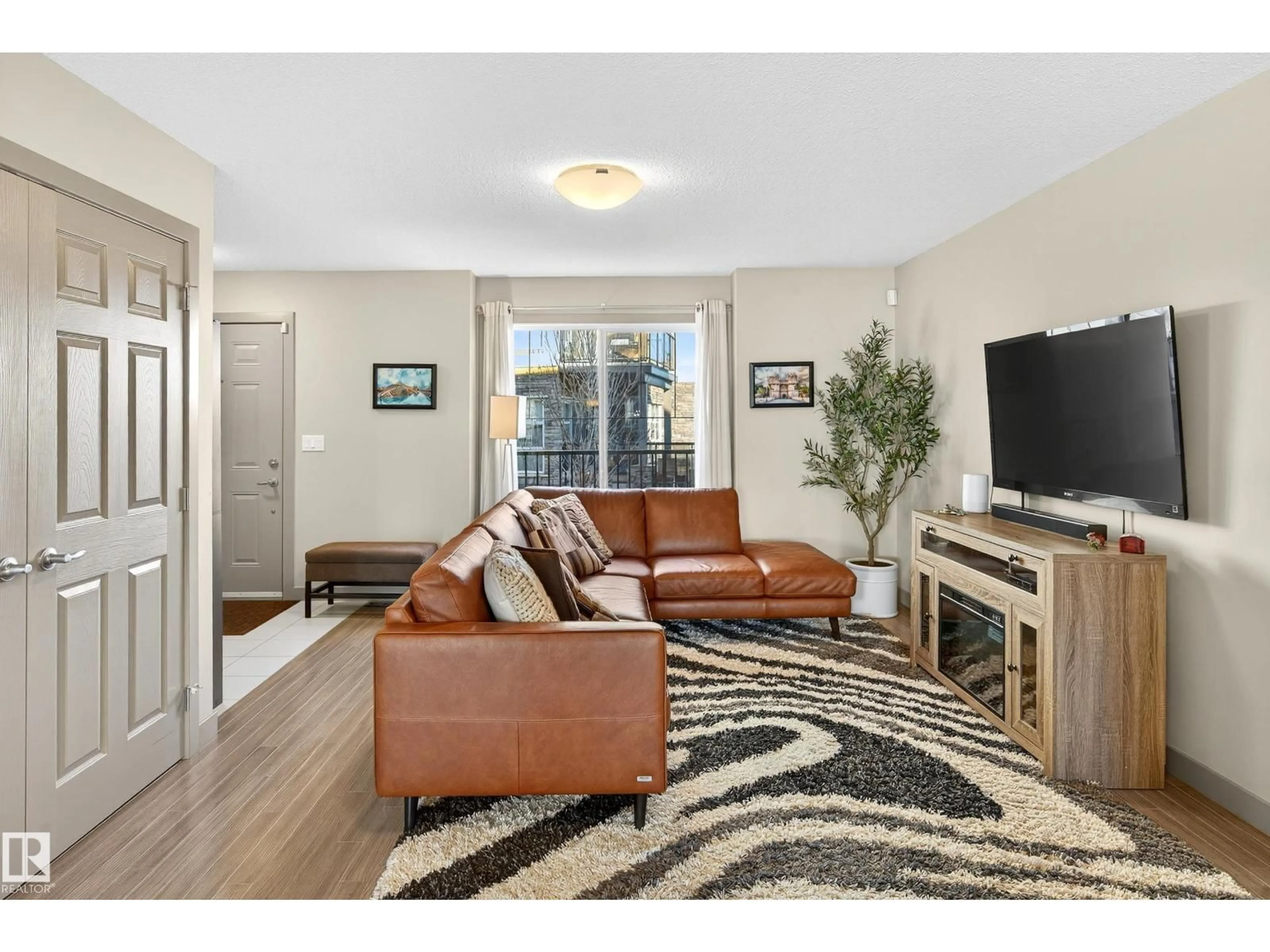 Living room with furniture, unknown for #6 - 1150 WINDEREMERE WY, Edmonton Alberta T6W2B6