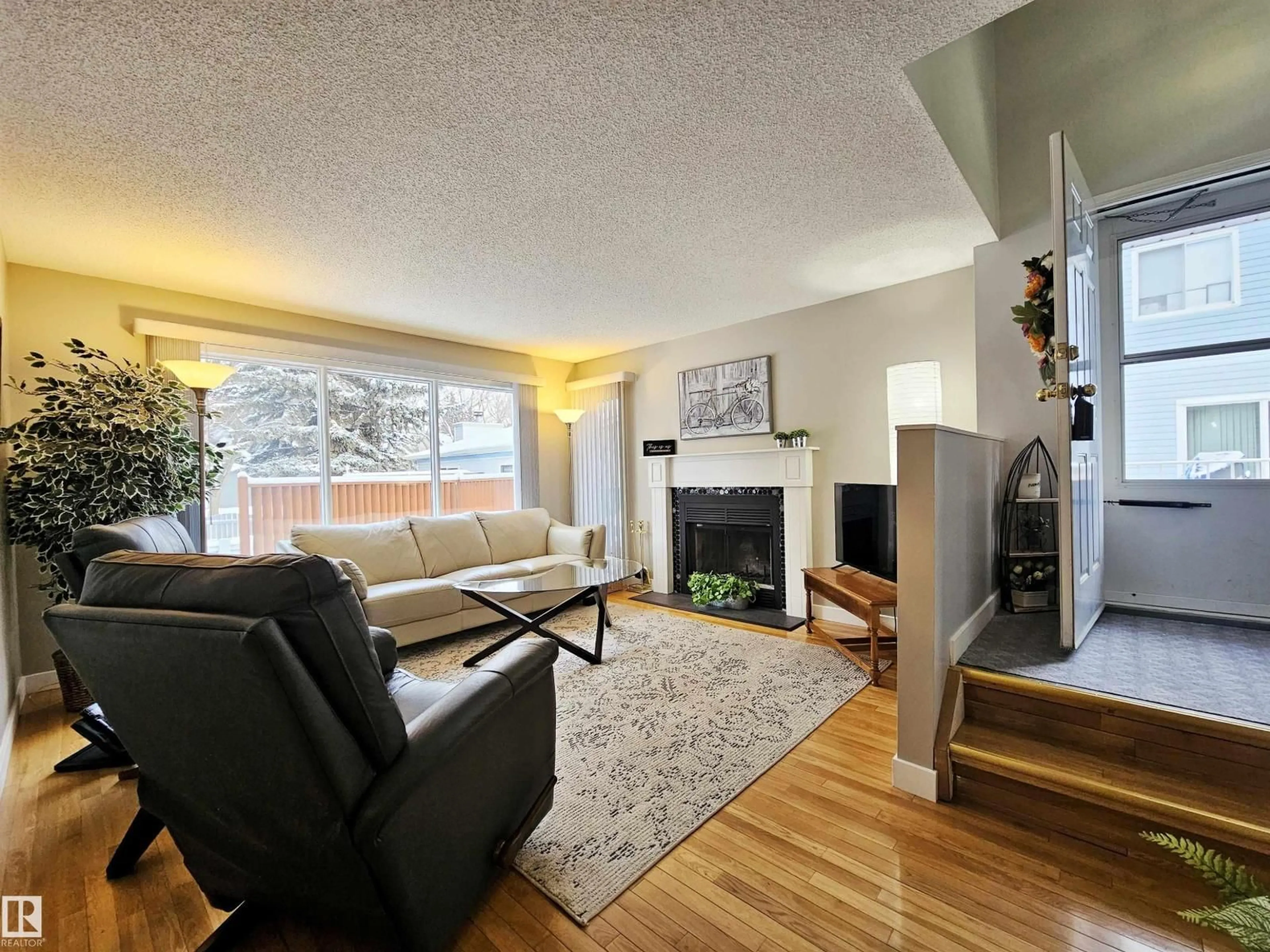 Living room with furniture, wood/laminate floor for 35 - 10 GARDEN RD, St. Albert Alberta T8N5W2