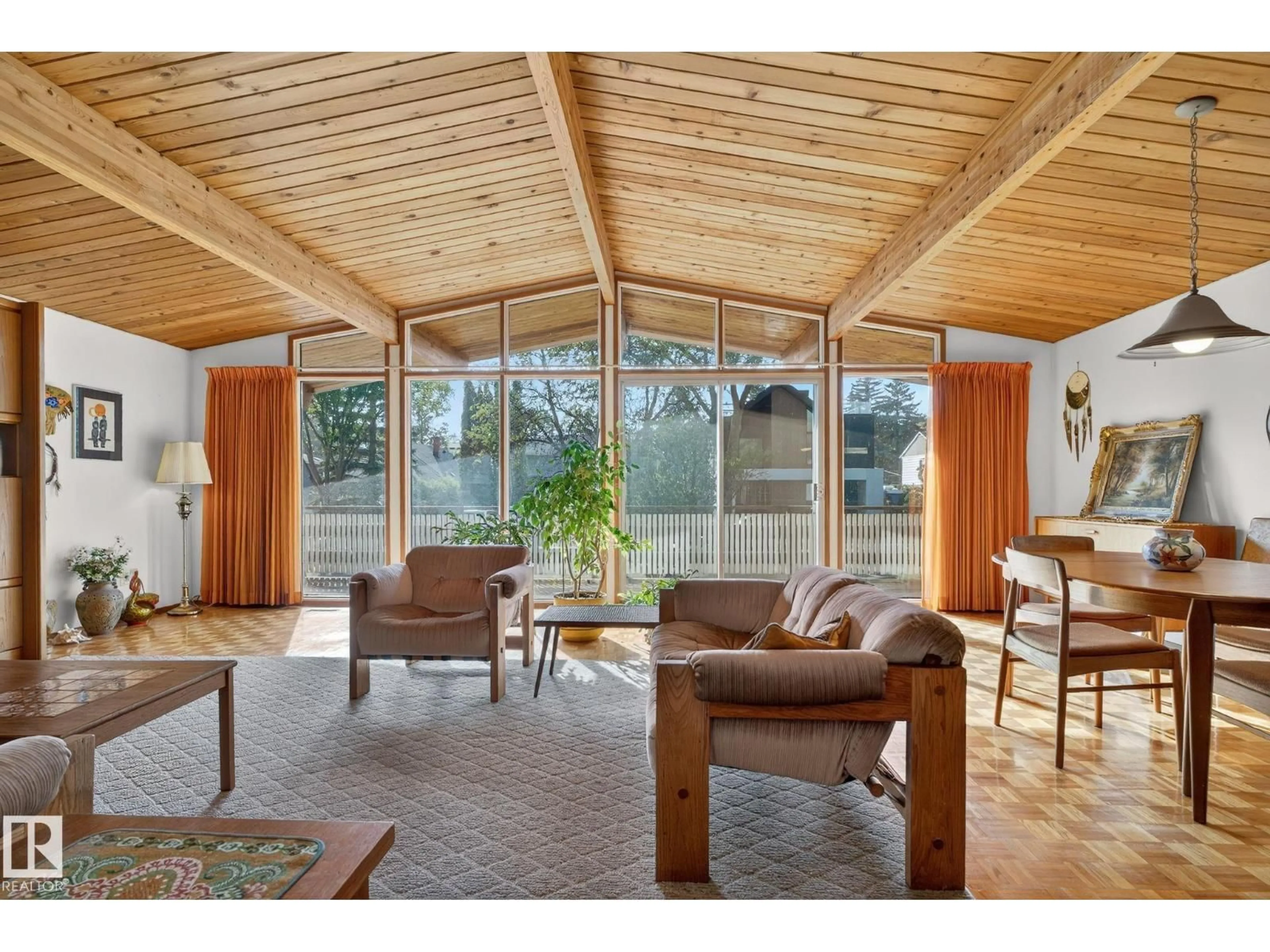 Living room with furniture, wood/laminate floor for 9937 82 ST, Edmonton Alberta T6A3L9