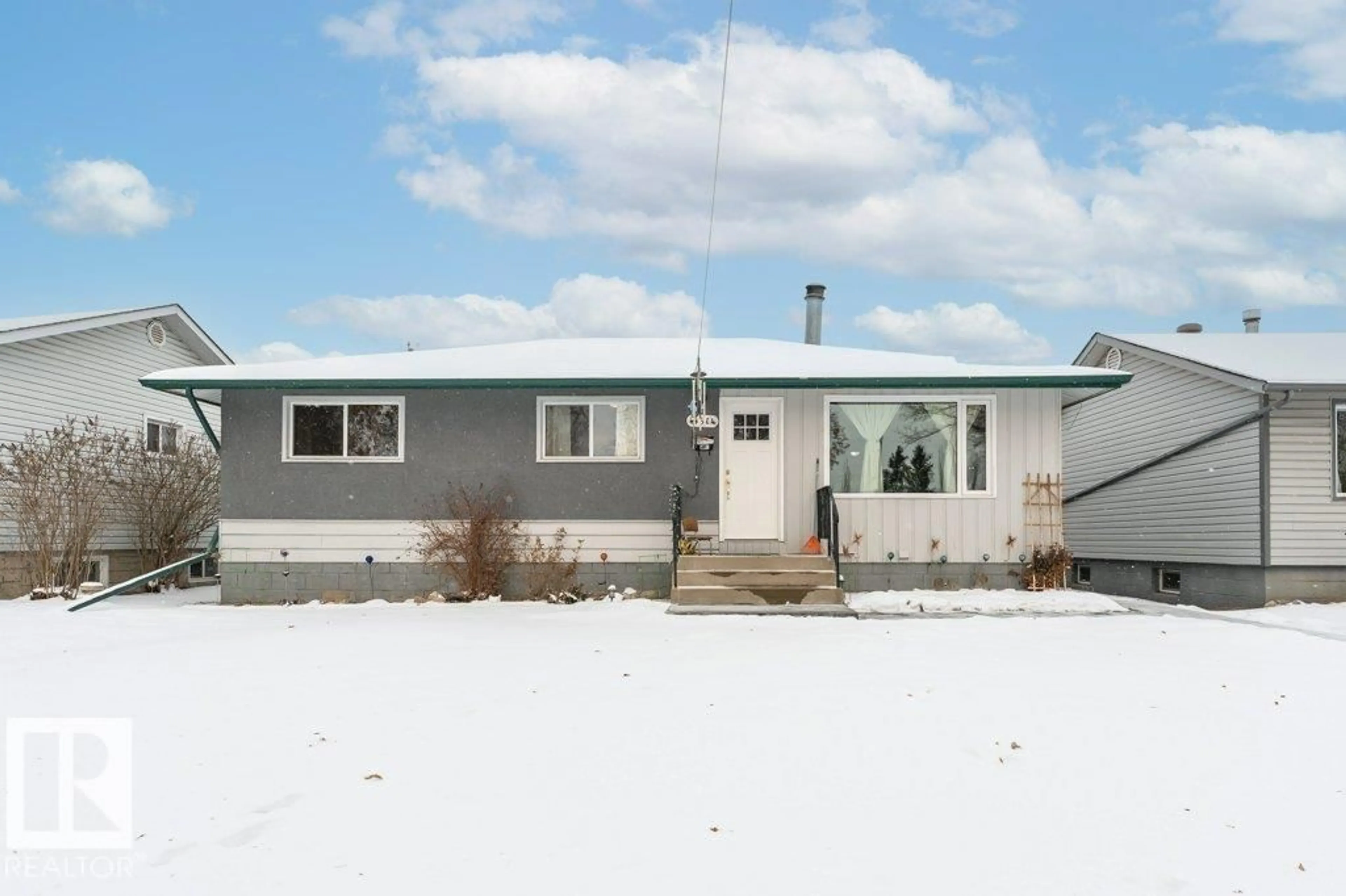 Home with vinyl exterior material, street for NW - 16614 105 AVENUE, Edmonton Alberta T5P0V3