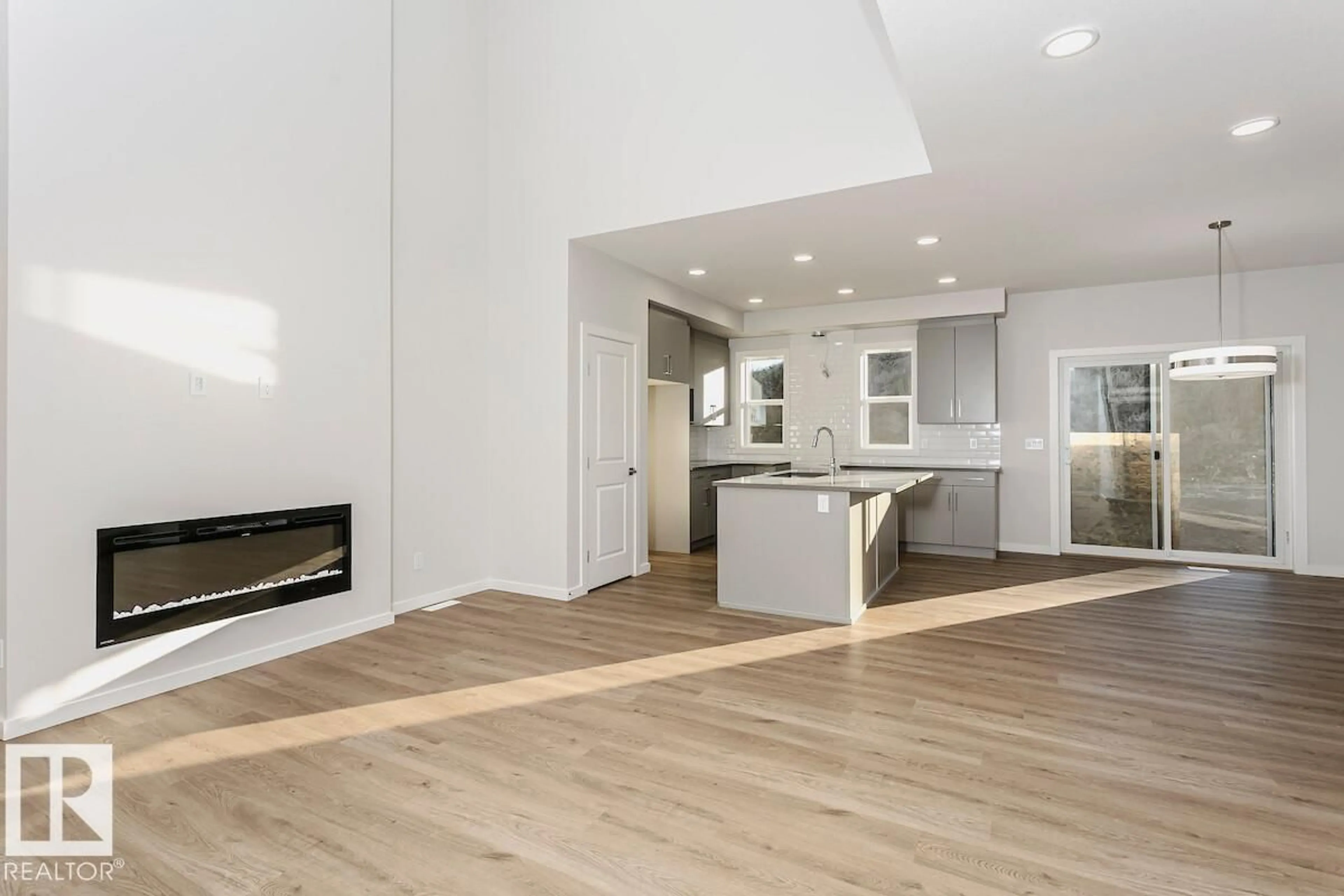 Open concept kitchen, wood/laminate floor for 4519 WARBLER LO, Edmonton Alberta T5S0S7