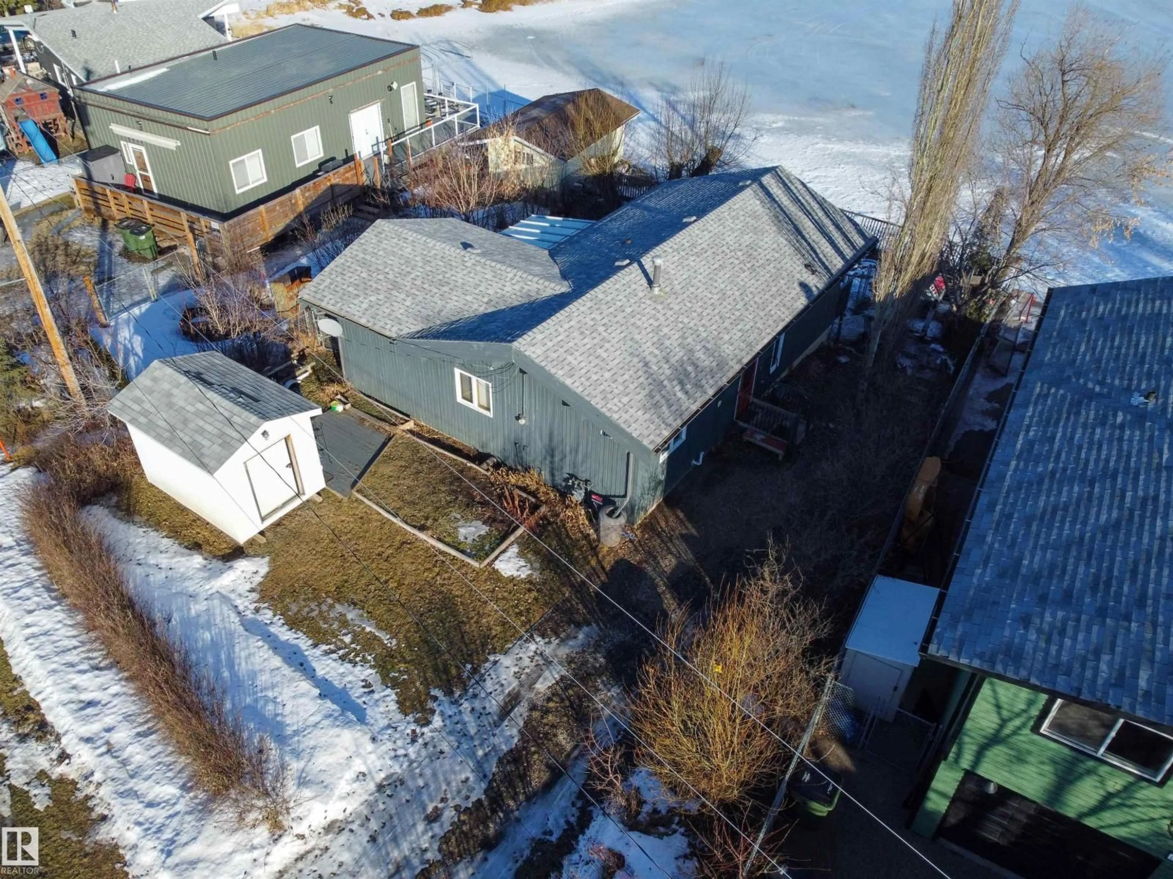 A pic from outside/outdoor area/front of a property/back of a property/a pic from drone, street for 6818 50 AV, Rural Lac Ste. Anne County Alberta T0E0A0