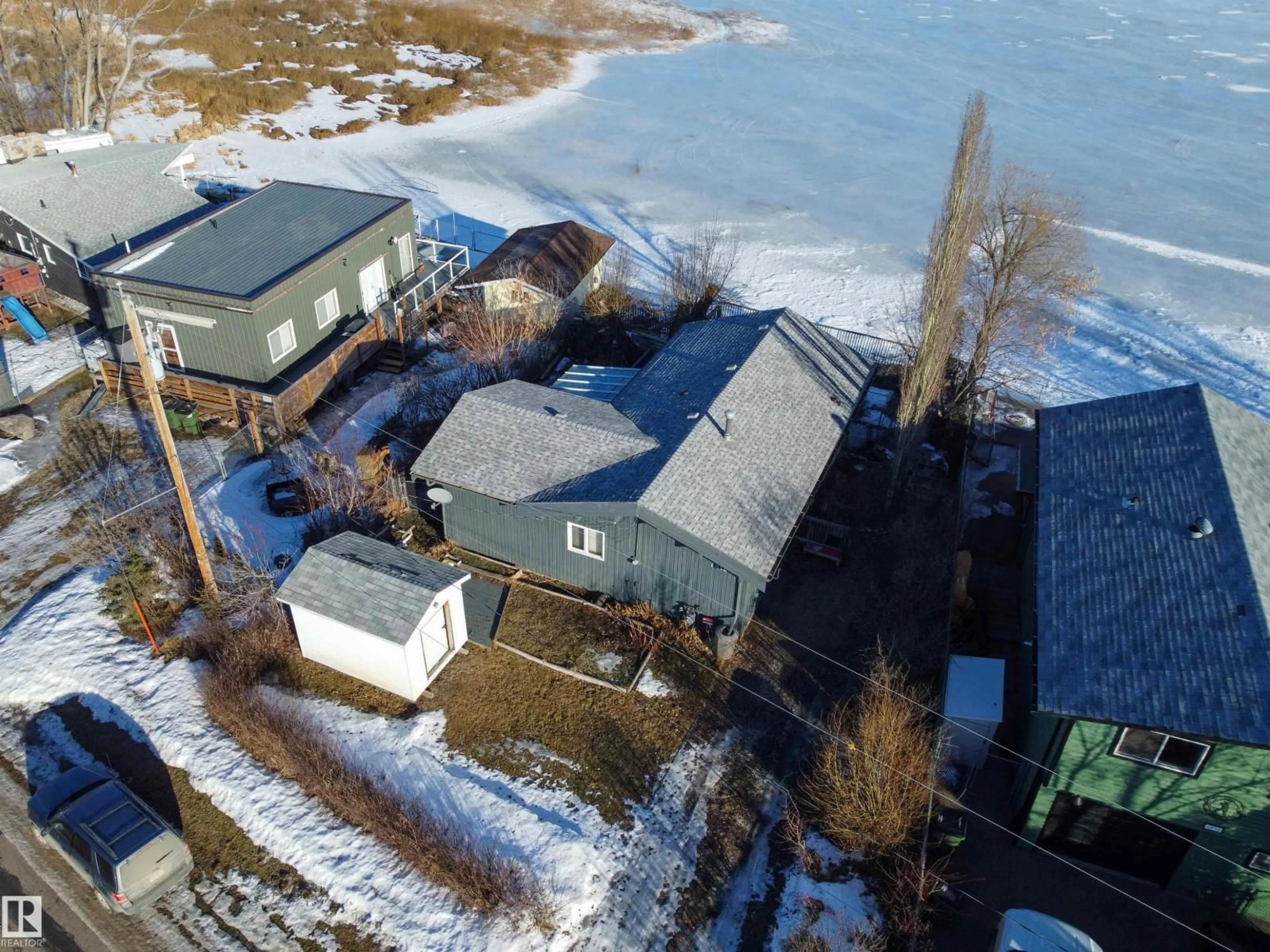 A pic from outside/outdoor area/front of a property/back of a property/a pic from drone, water/lake/river/ocean view for 6818 50 AV, Rural Lac Ste. Anne County Alberta T0E0A0