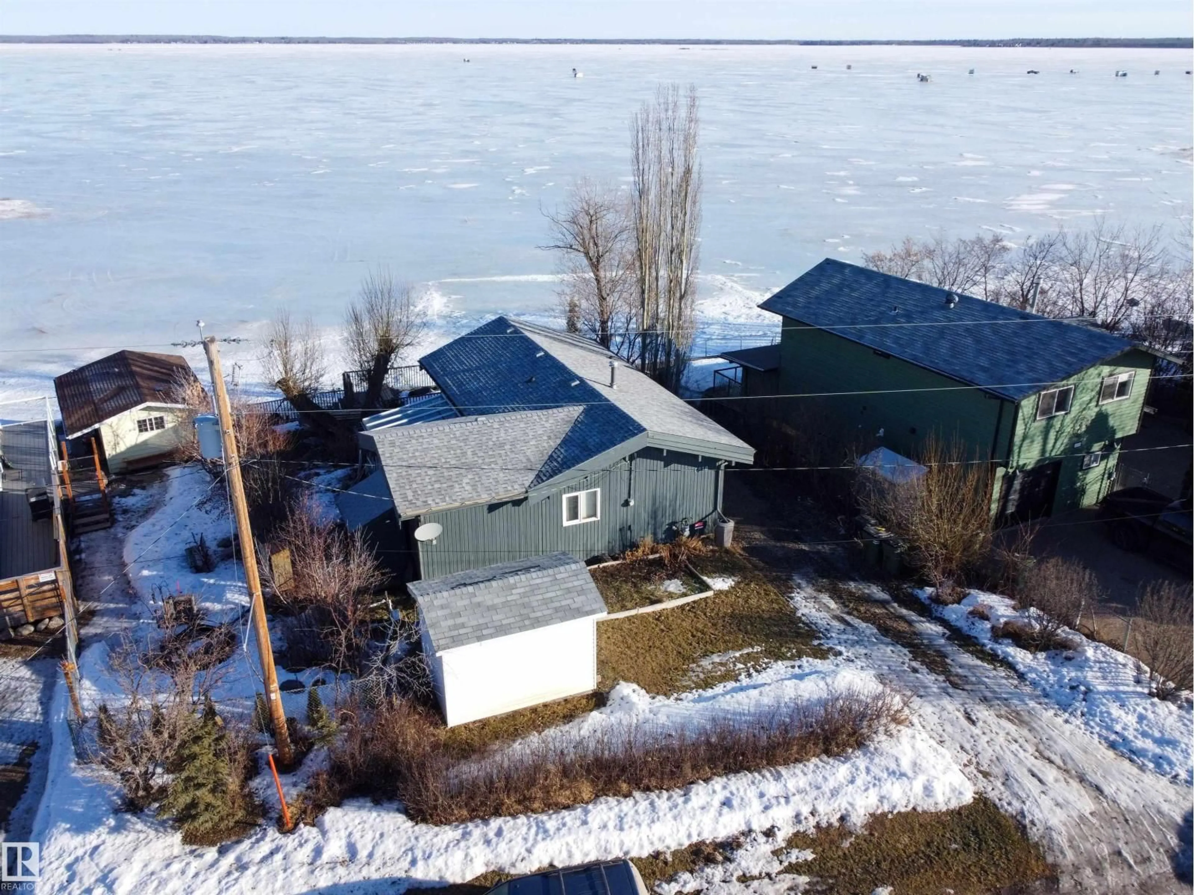 A pic from outside/outdoor area/front of a property/back of a property/a pic from drone, water/lake/river/ocean view for 6818 50 AV, Rural Lac Ste. Anne County Alberta T0E0A0