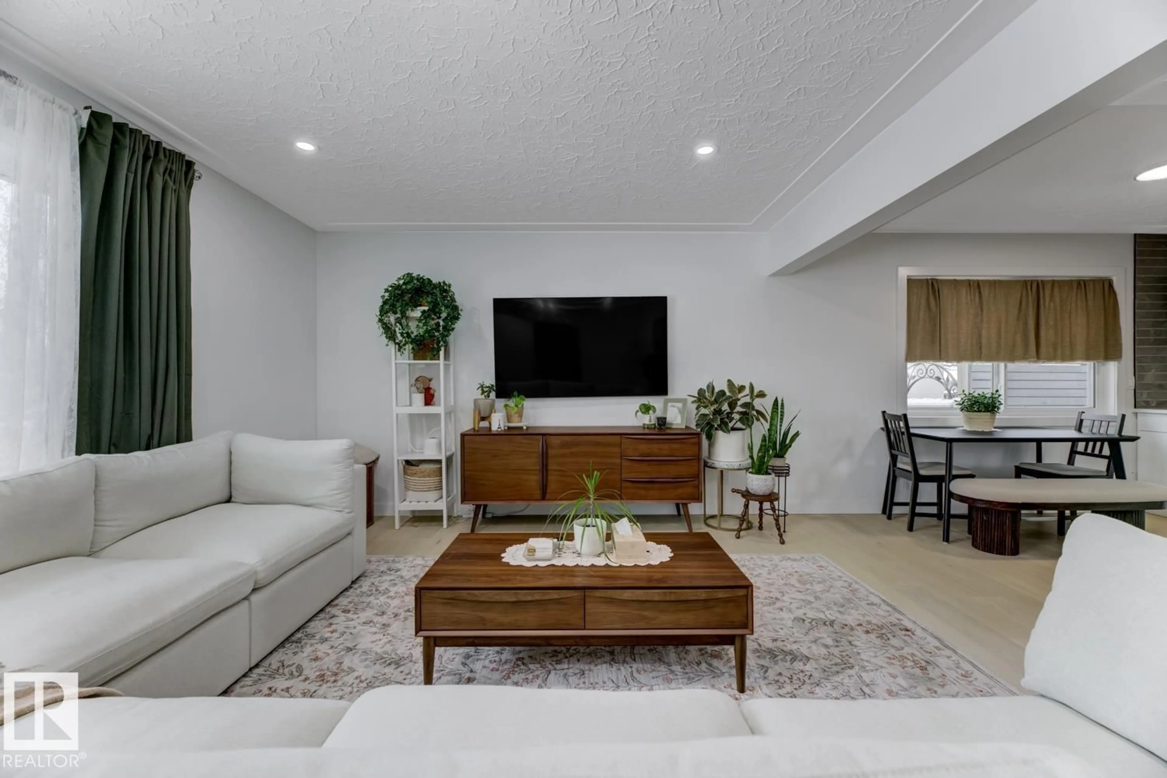 Living room with furniture, unknown for NW - 6823 98 AV, Edmonton Alberta T6A0A6