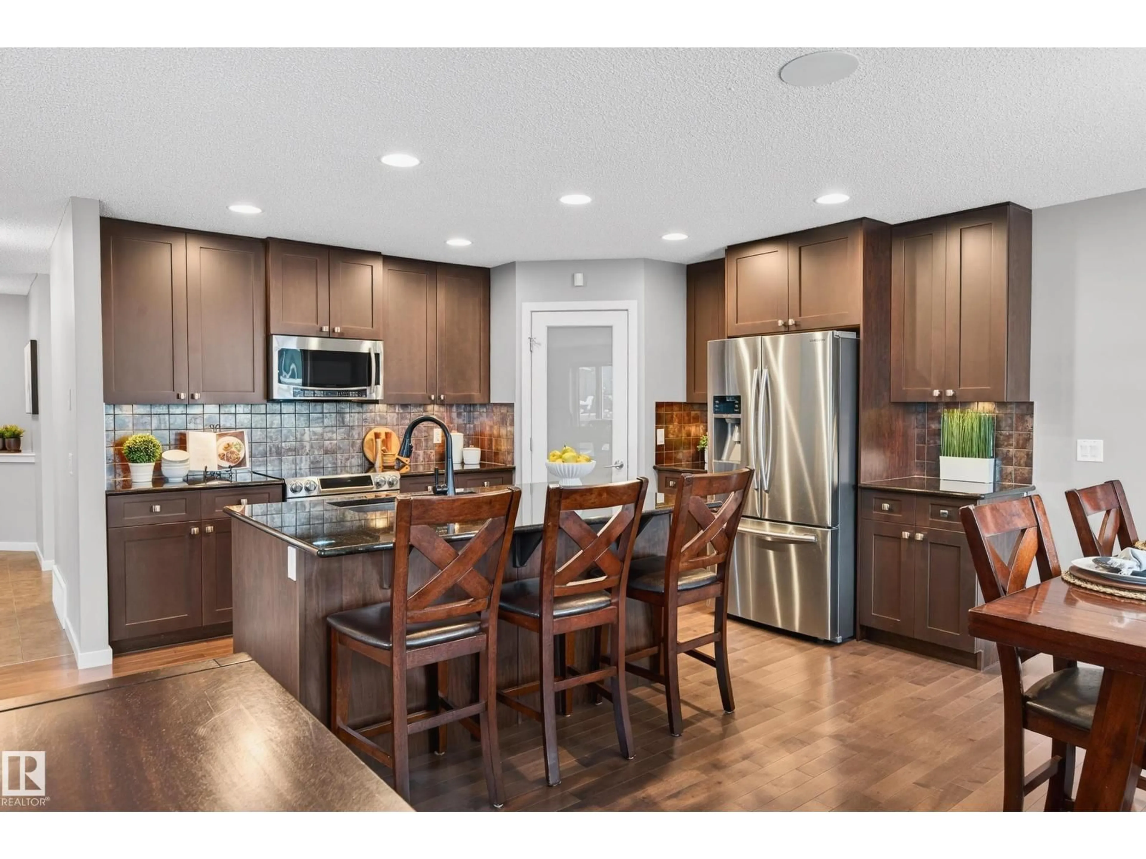 Open concept kitchen, wood/laminate floor for 21711 85 AV, Edmonton Alberta T5T2J6