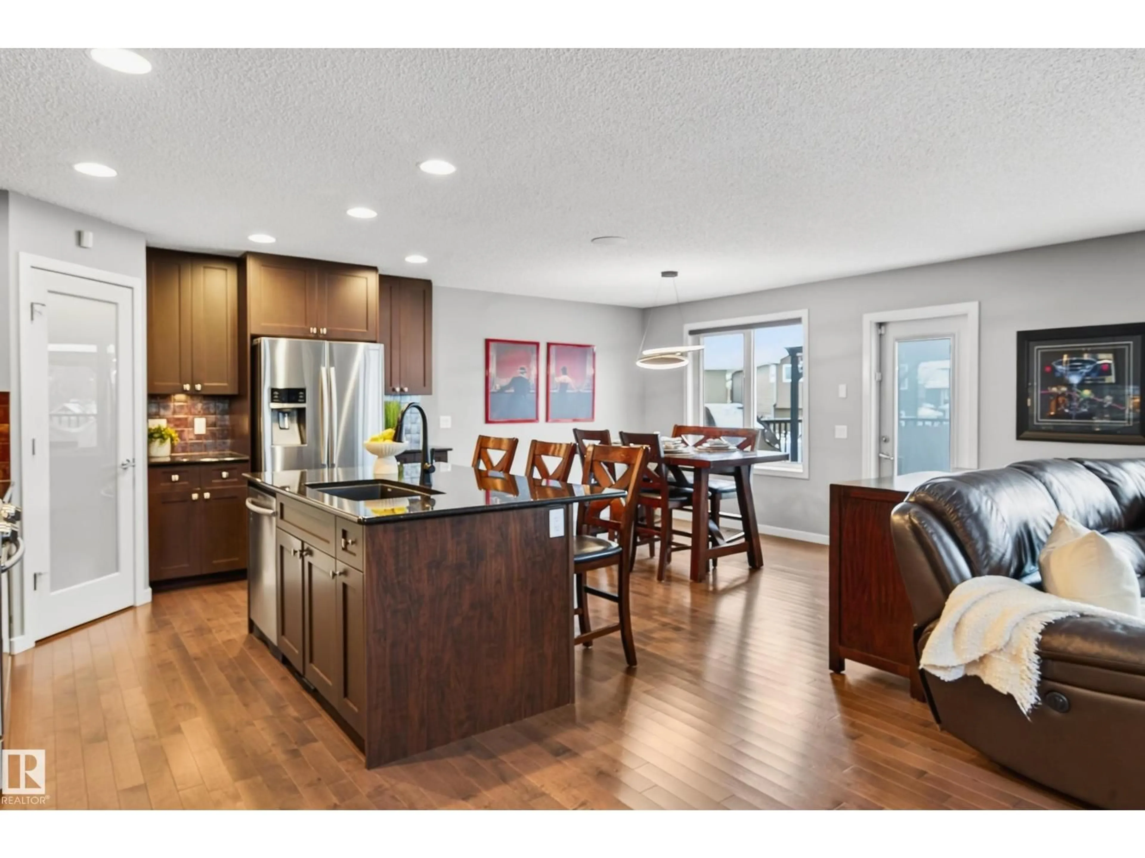 Open concept kitchen, wood/laminate floor for 21711 85 AV, Edmonton Alberta T5T2J6