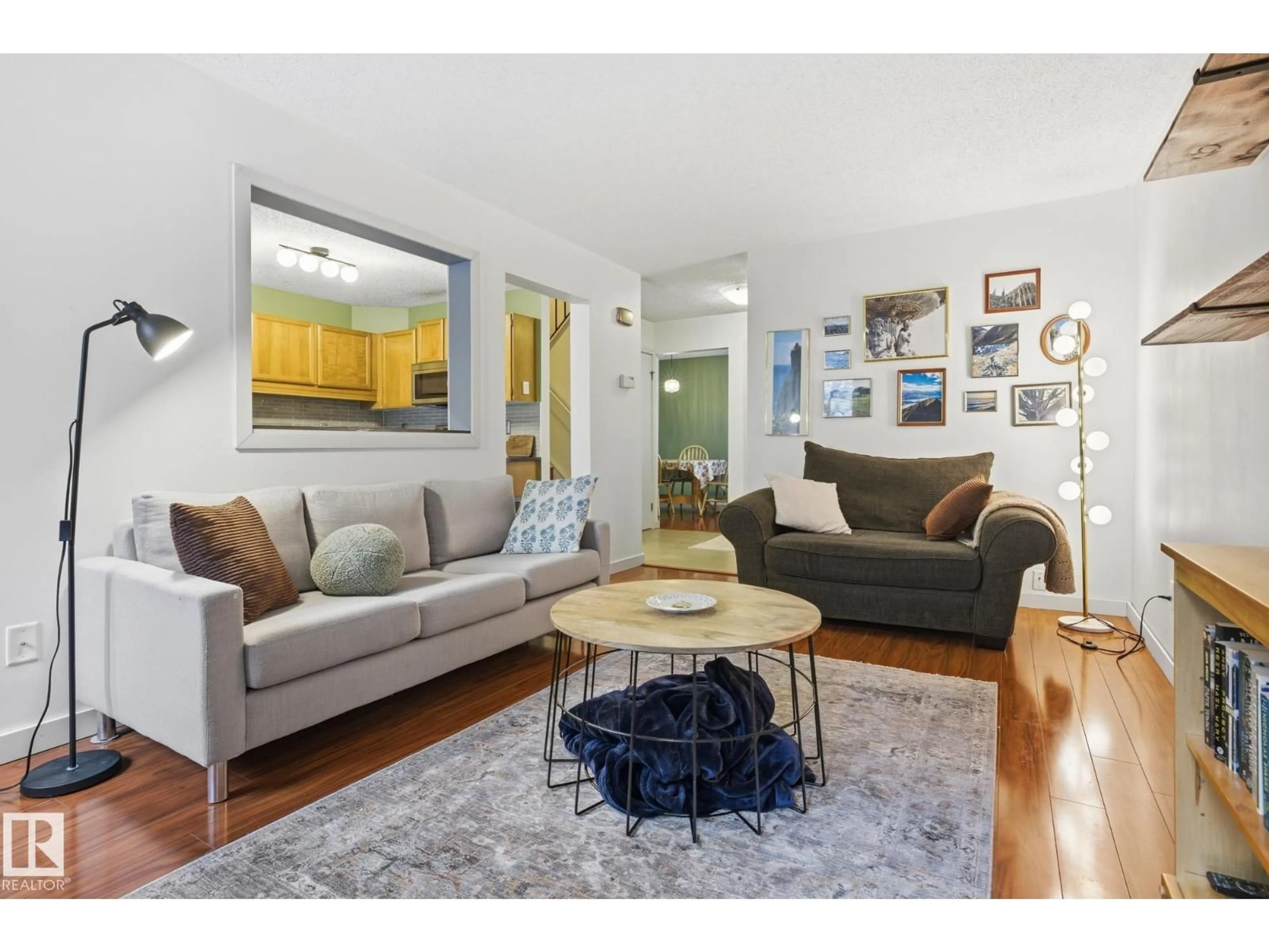 Living room with furniture, wood/laminate floor for 18024 96 AV, Edmonton Alberta T5T3N2