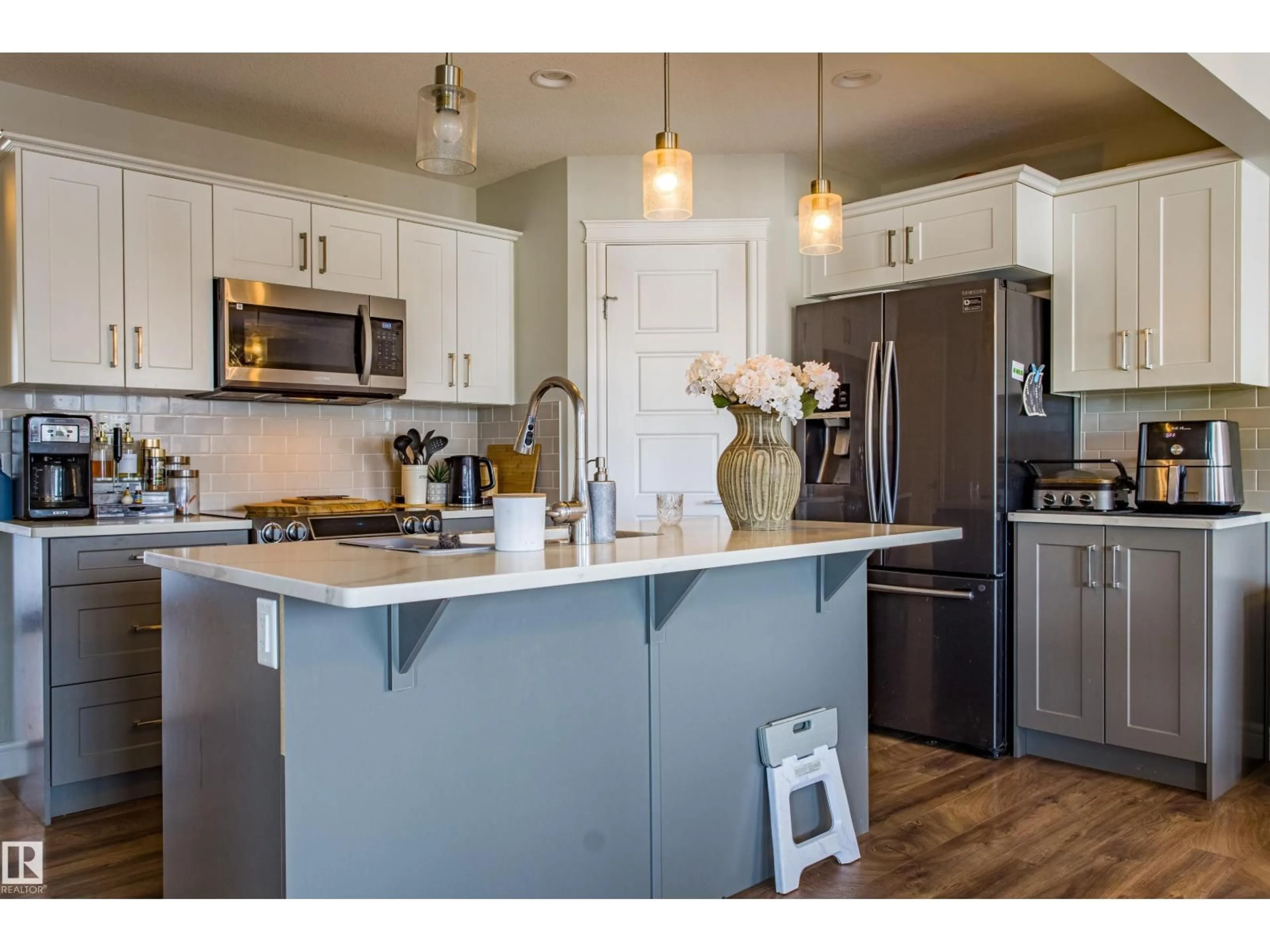 Open concept kitchen, wood/laminate floor for SW - 5704 HAWTHORN CM, Edmonton Alberta T6X2L5