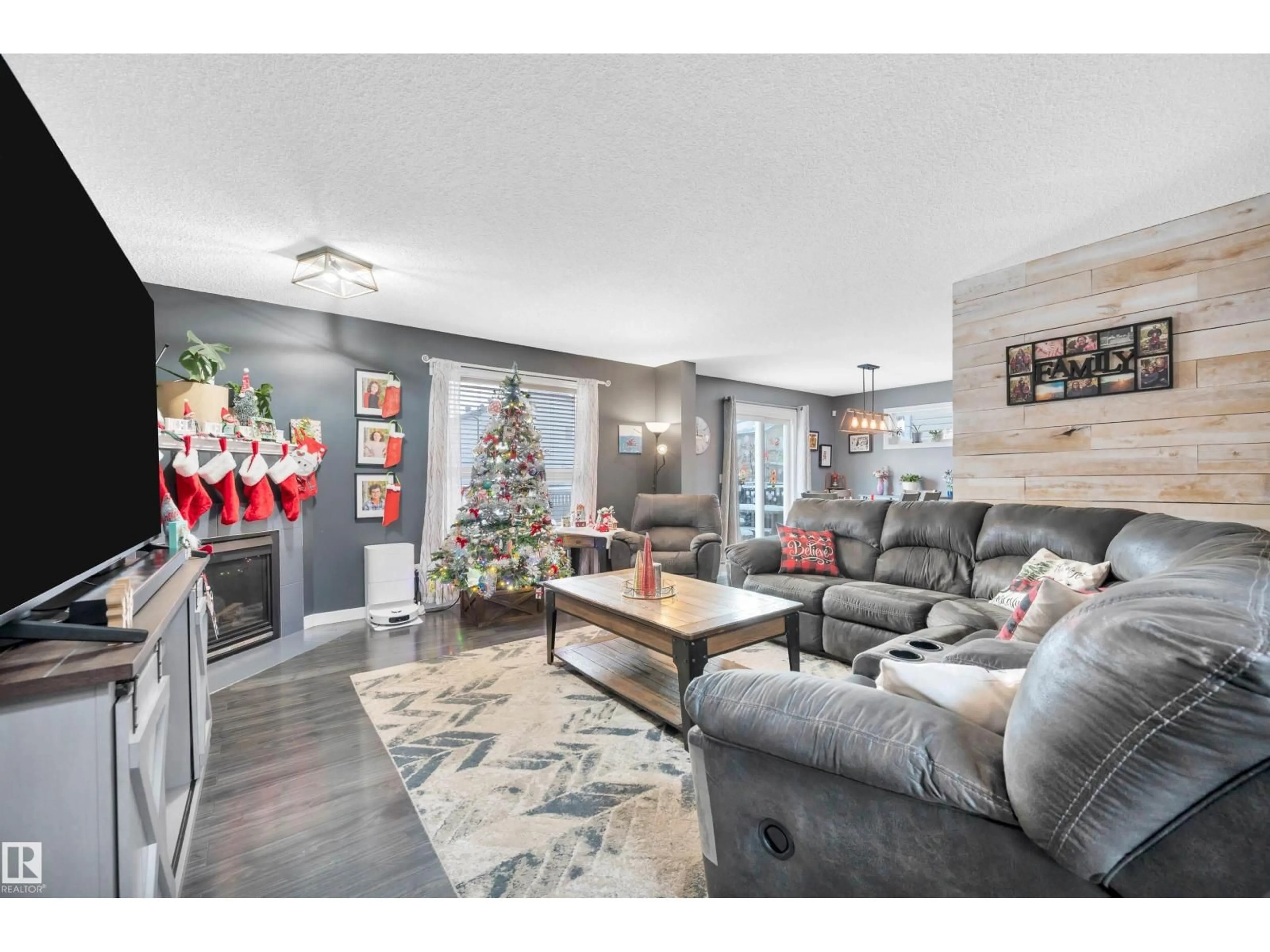 Living room with furniture, wood/laminate floor for 27 DOUGLAS CR, Leduc Alberta T9E8P4