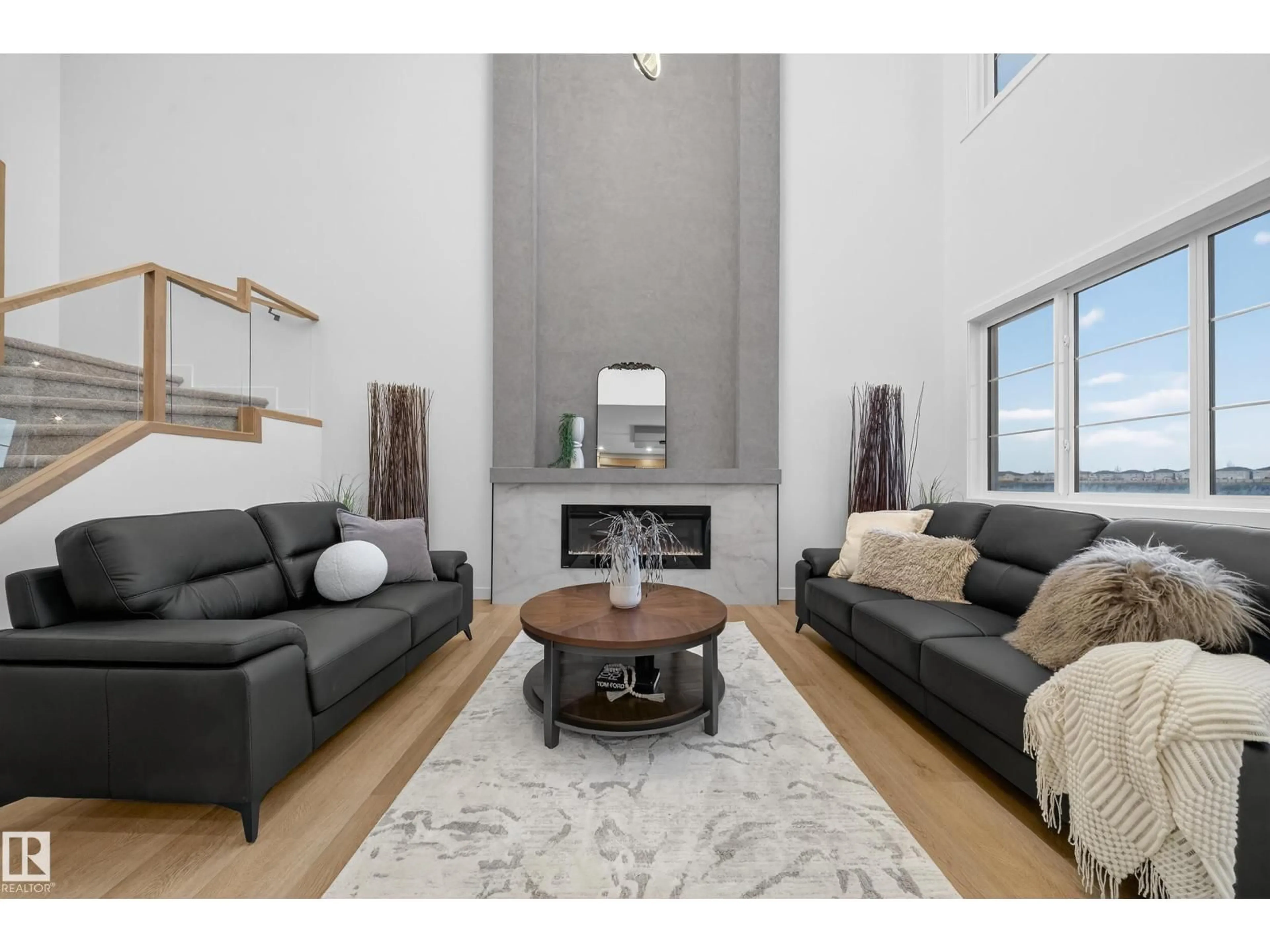 Living room with furniture, wood/laminate floor for 208 CRYSTAL CREEK DRIVE, Leduc Alberta T9E0X6