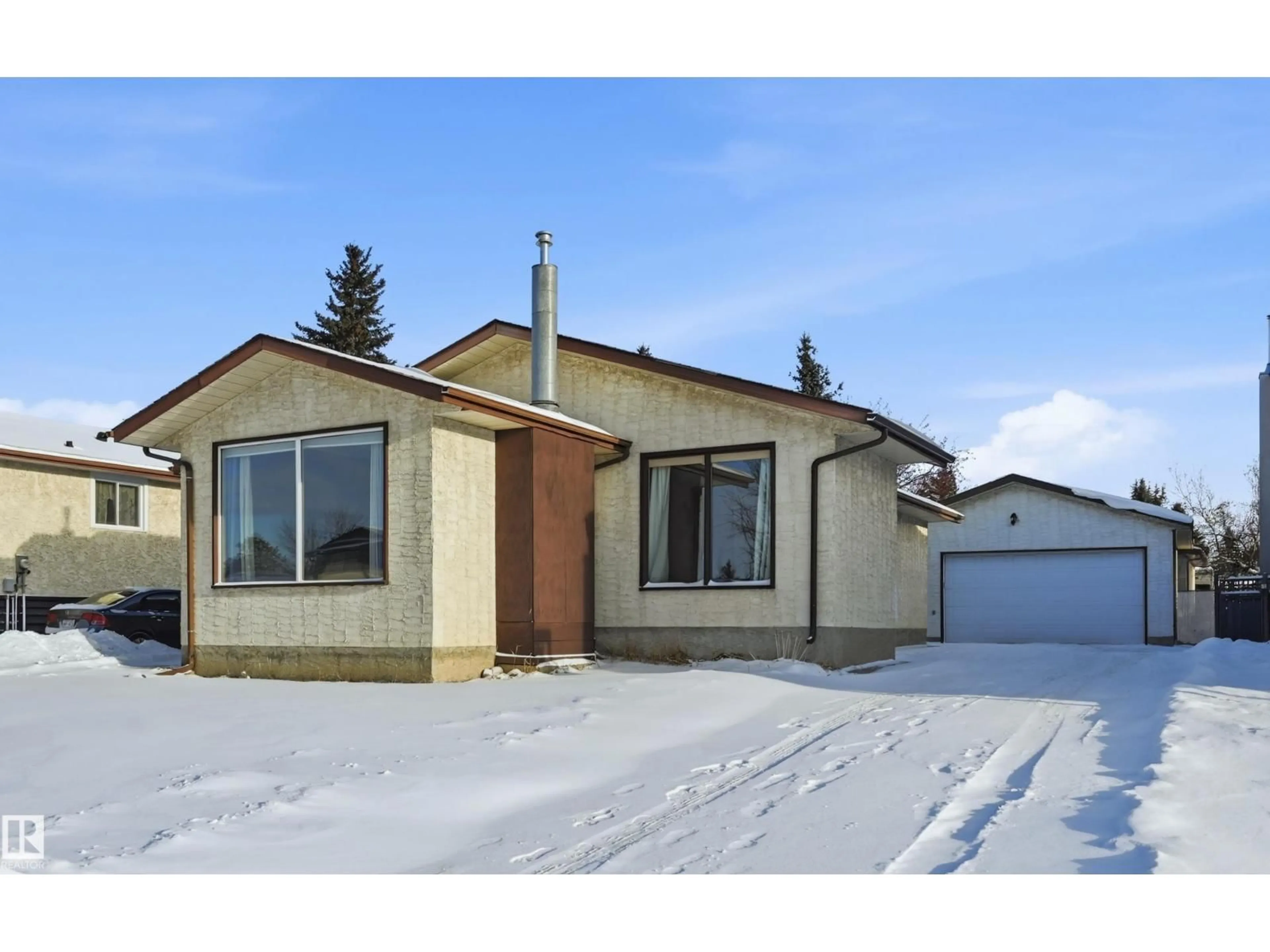 Home with vinyl exterior material, street for NW - 2007 49A ST, Edmonton Alberta T6L2W9