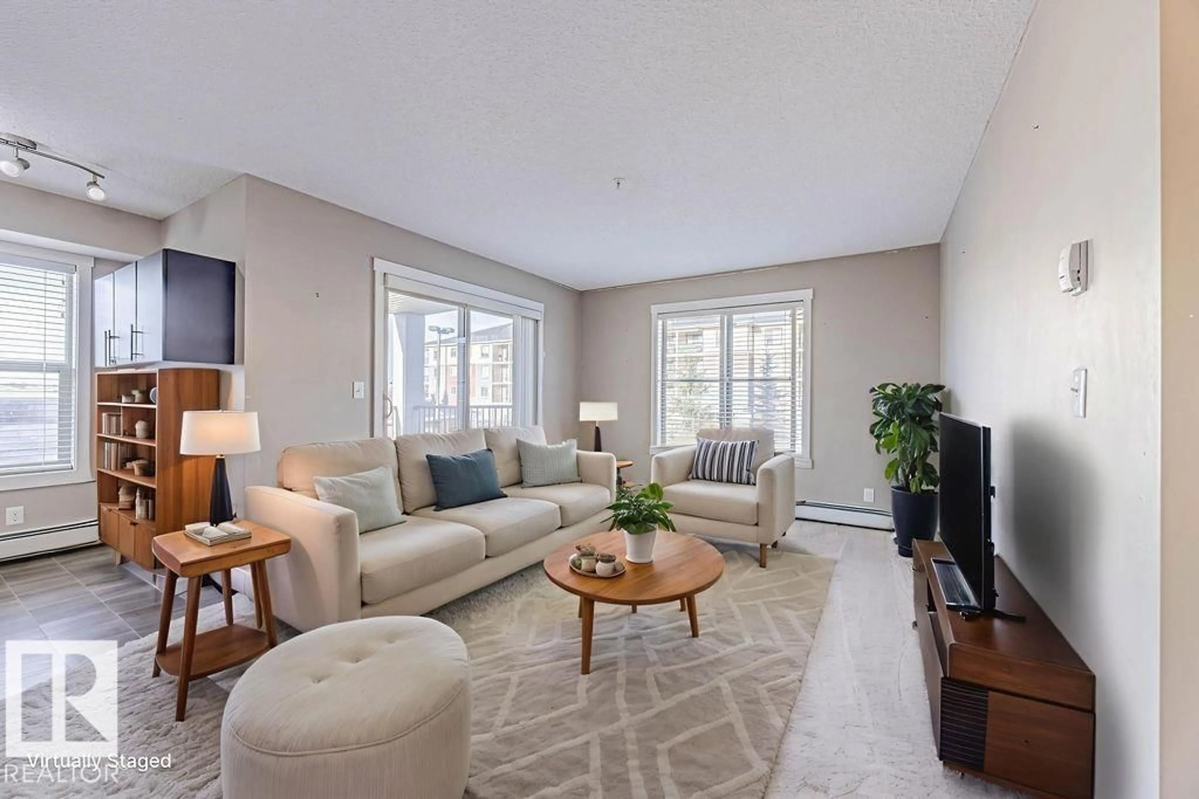 Living room with furniture, unknown for 202 - 5816 MULLEN PL, Edmonton Alberta T6R0W3