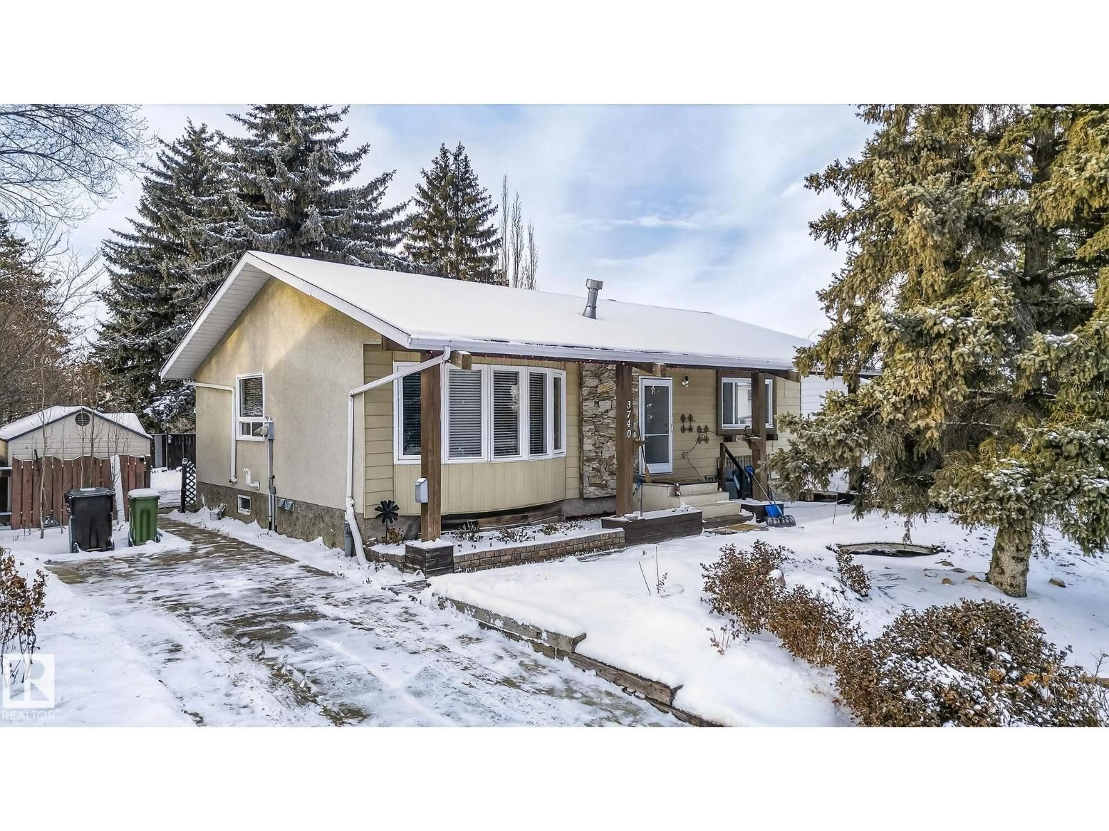 Home with vinyl exterior material, street for 3740 63 ST, Edmonton Alberta T6L1P8