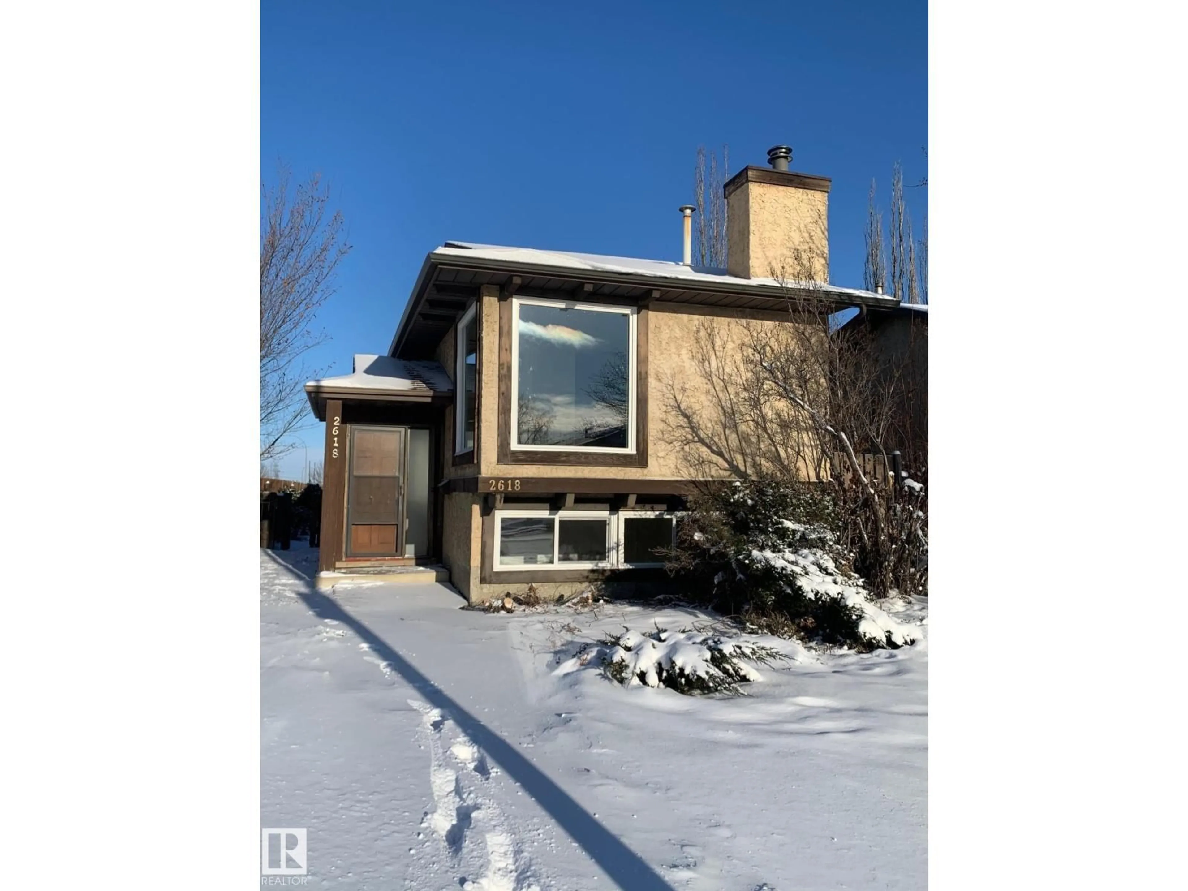 Home with vinyl exterior material, street for NW - 2618 151 AV, Edmonton Alberta T5Y1Z3