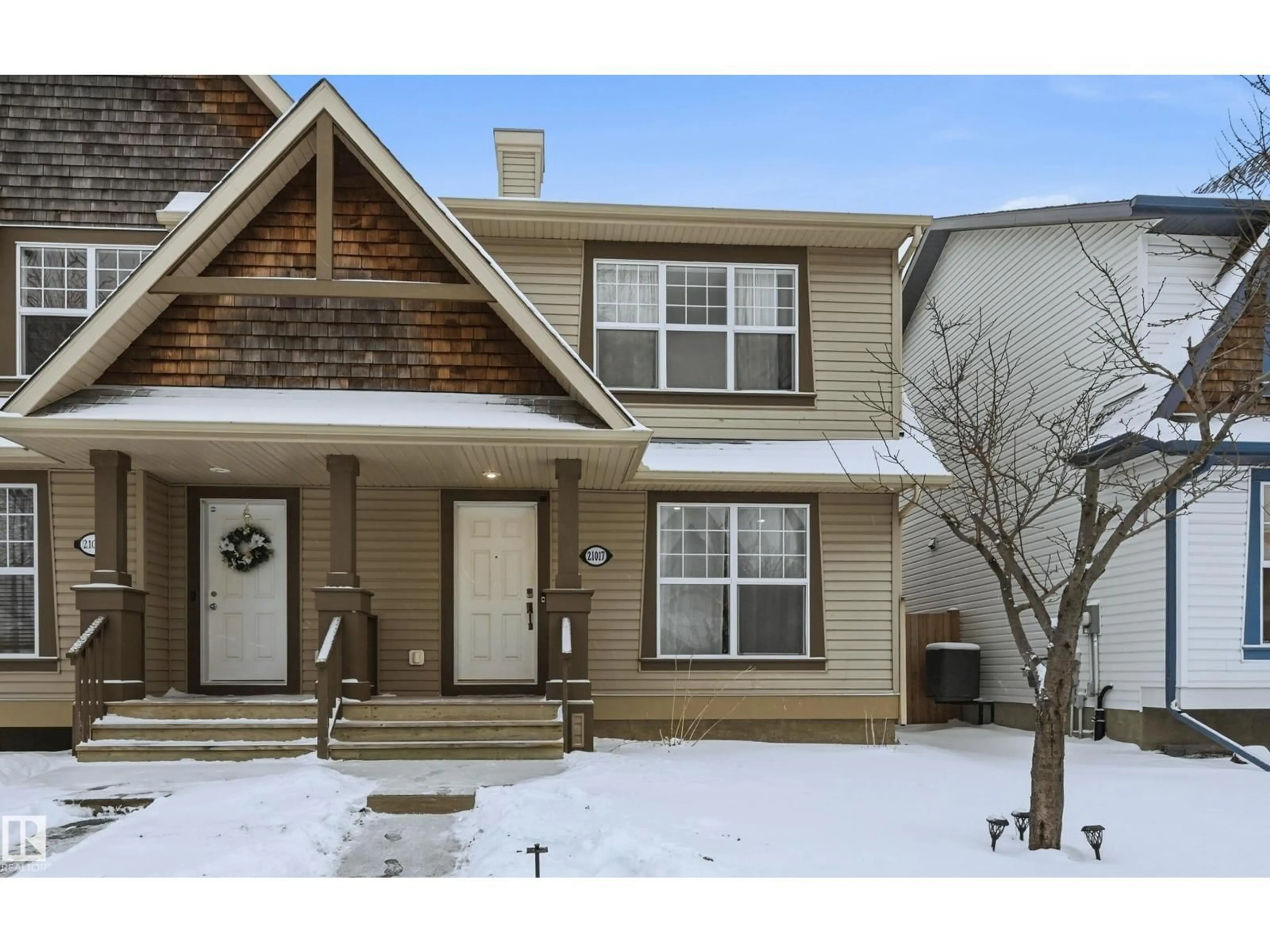 Home with vinyl exterior material, street for 21017 60 AV, Edmonton Alberta T6M0H6