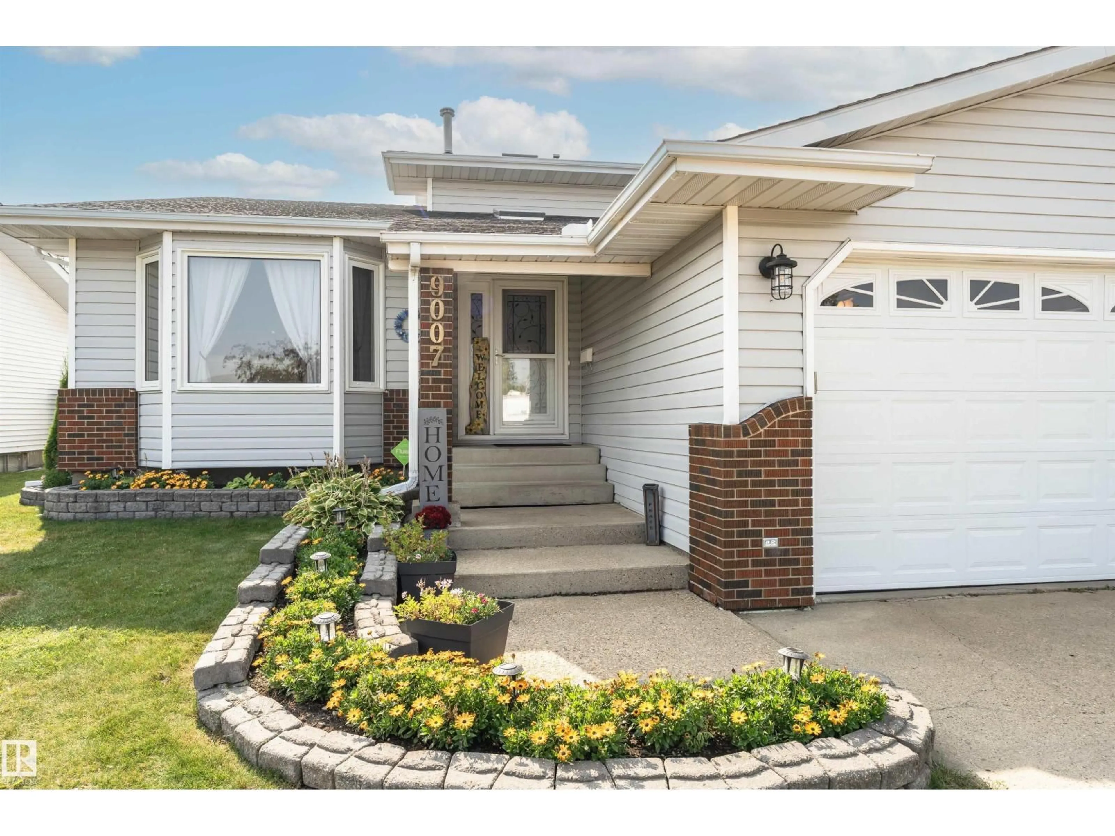 Home with vinyl exterior material, street for 9007 102 AV, Morinville Alberta T8R1B5