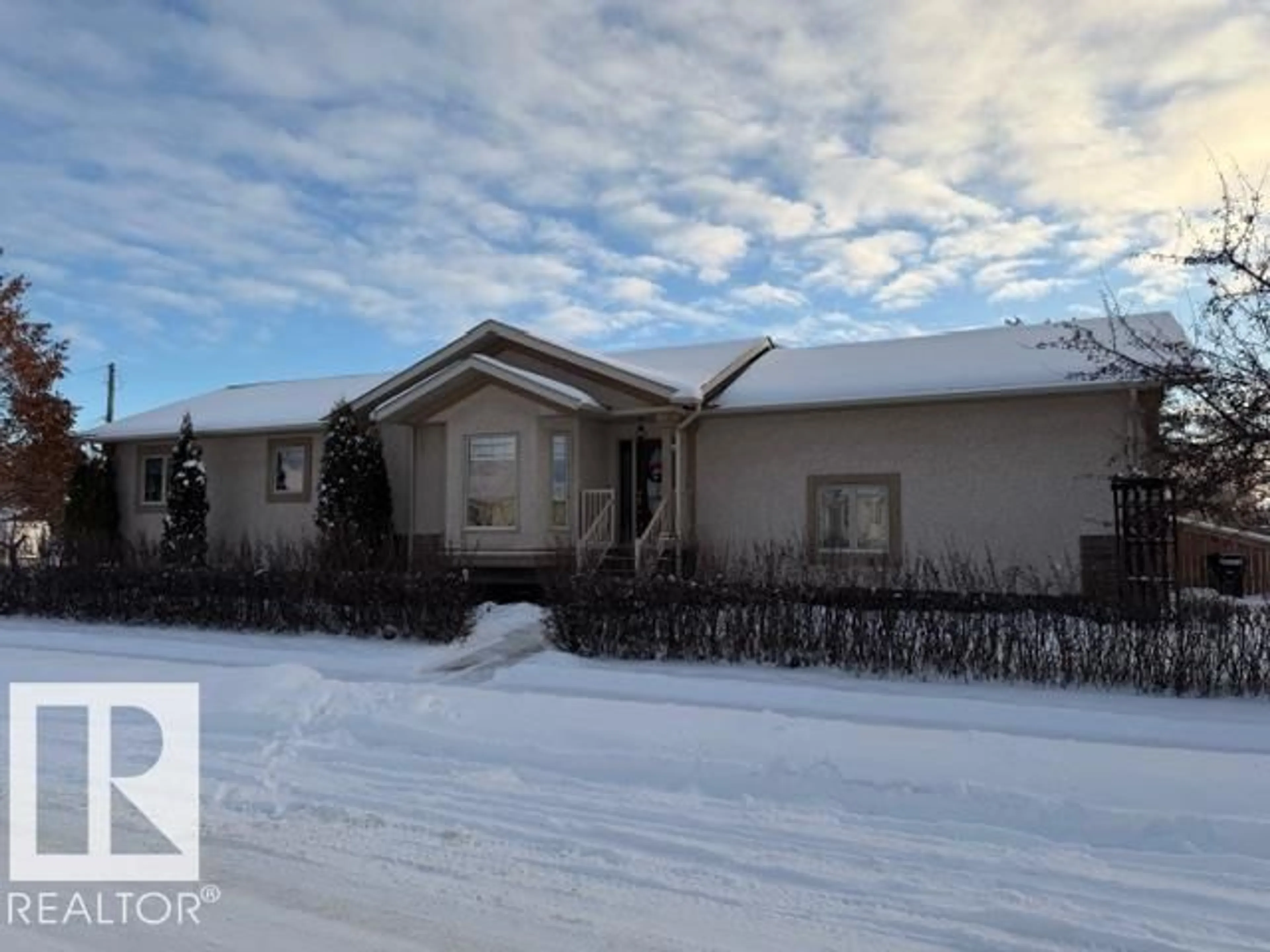 Home with vinyl exterior material, street for 5125 48 ST, Barrhead Alberta T7N1H2