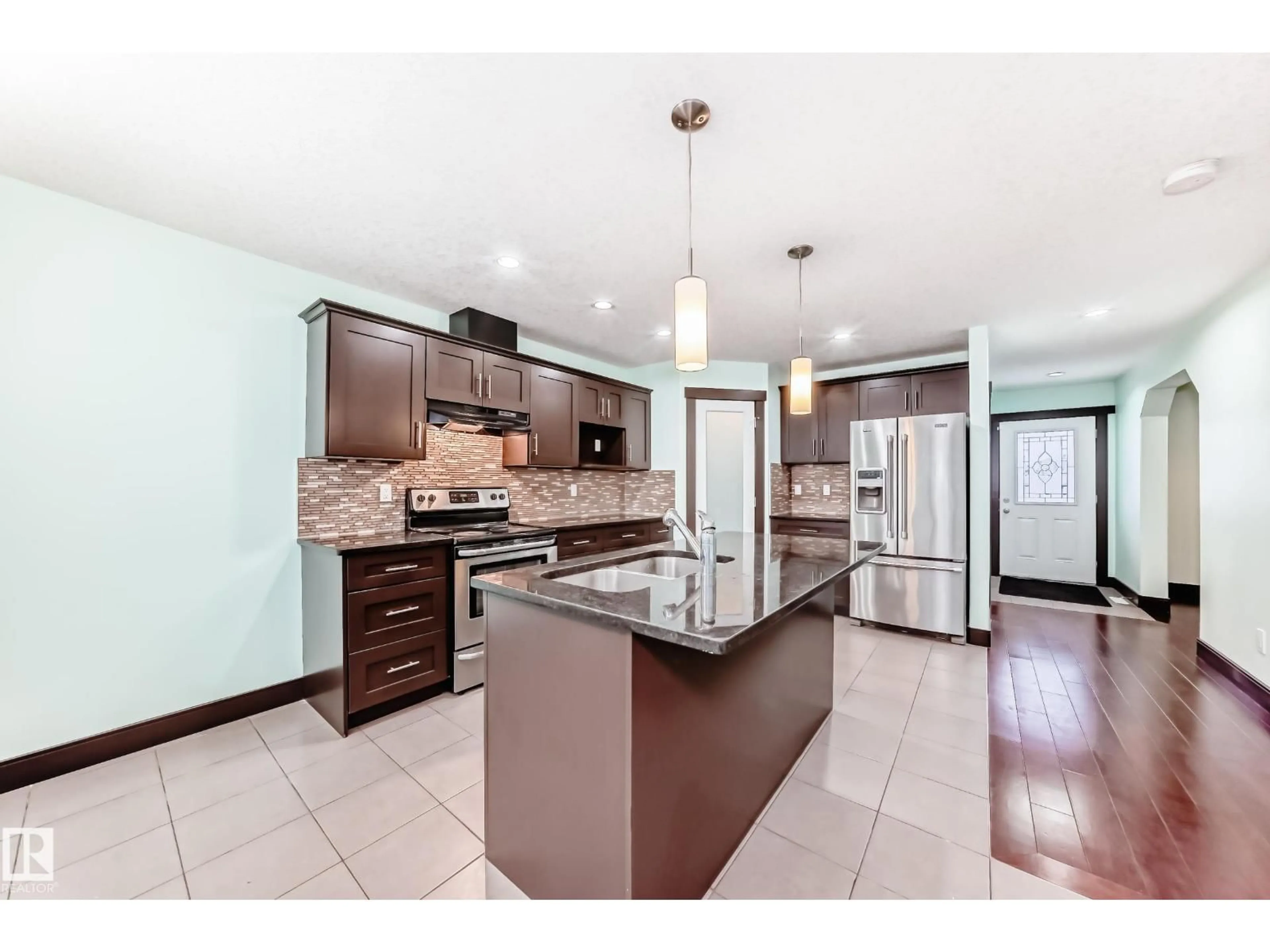 Open concept kitchen, ceramic/tile floor for 12910 128 ST, Edmonton Alberta T5L1E5