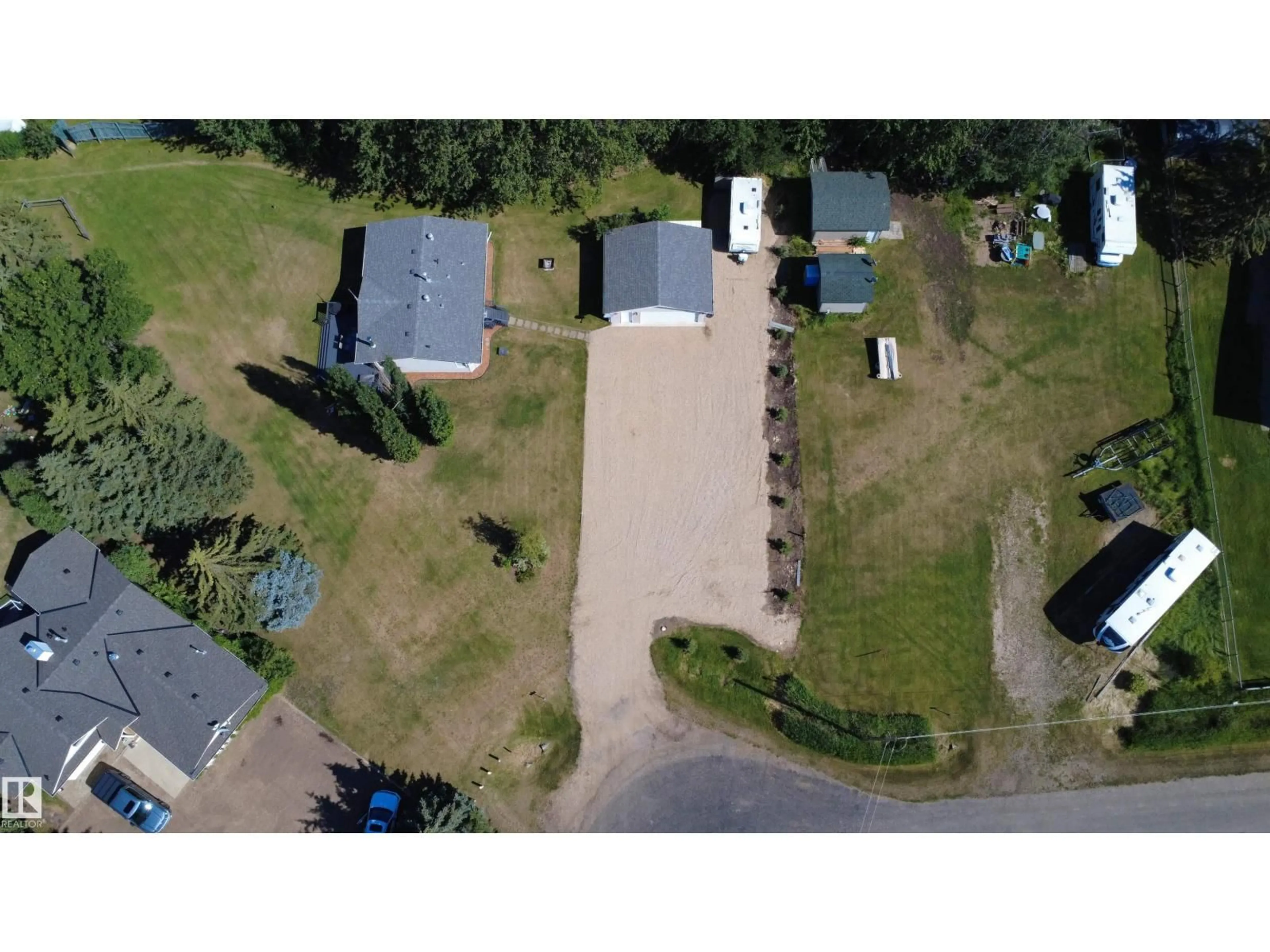 A pic from outside/outdoor area/front of a property/back of a property/a pic from drone, street for 215 LABONTE DR, Rural Athabasca County Alberta T0A0M0