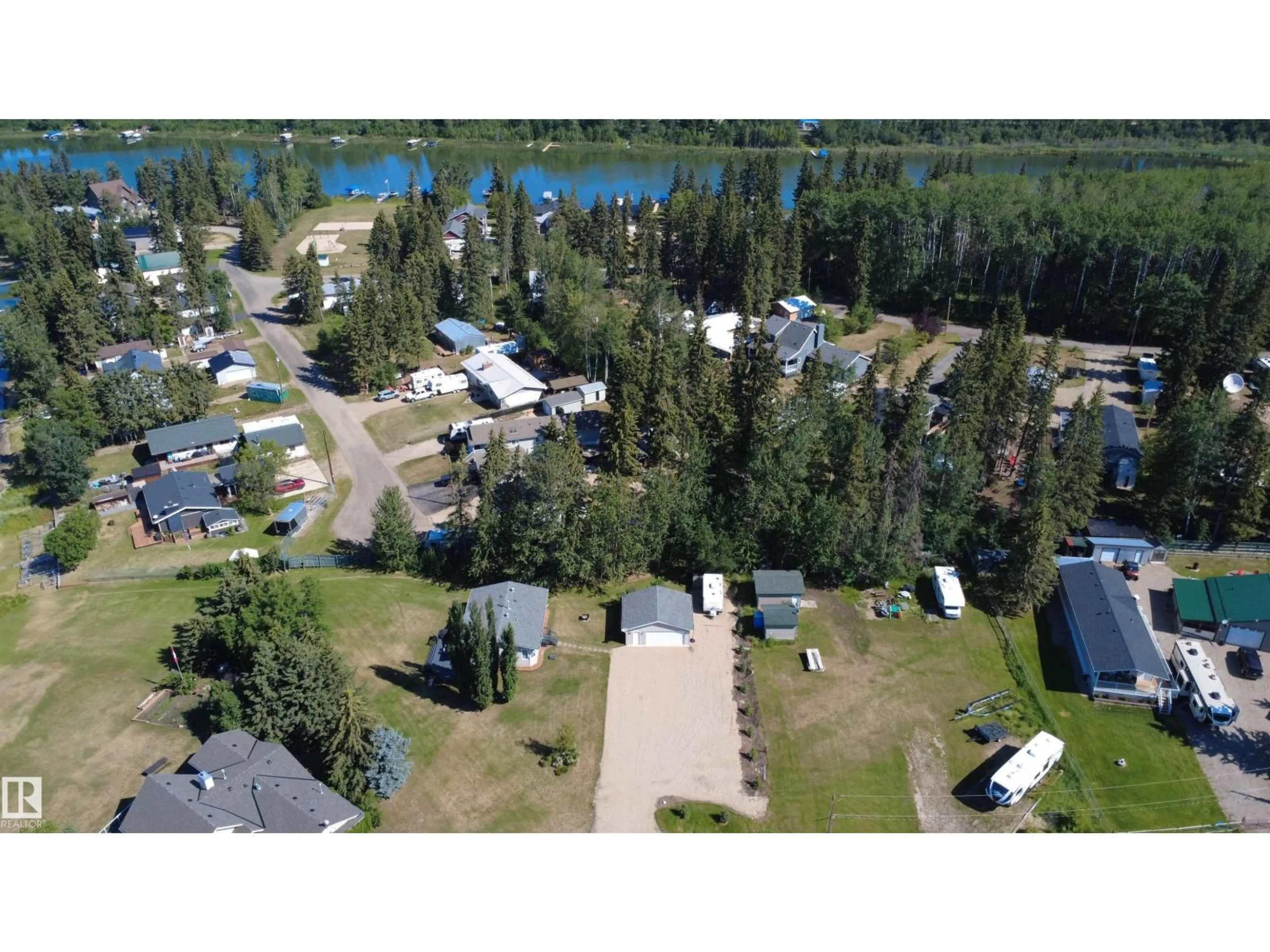 A pic from outside/outdoor area/front of a property/back of a property/a pic from drone, water/lake/river/ocean view for 215 LABONTE DR, Rural Athabasca County Alberta T0A0M0