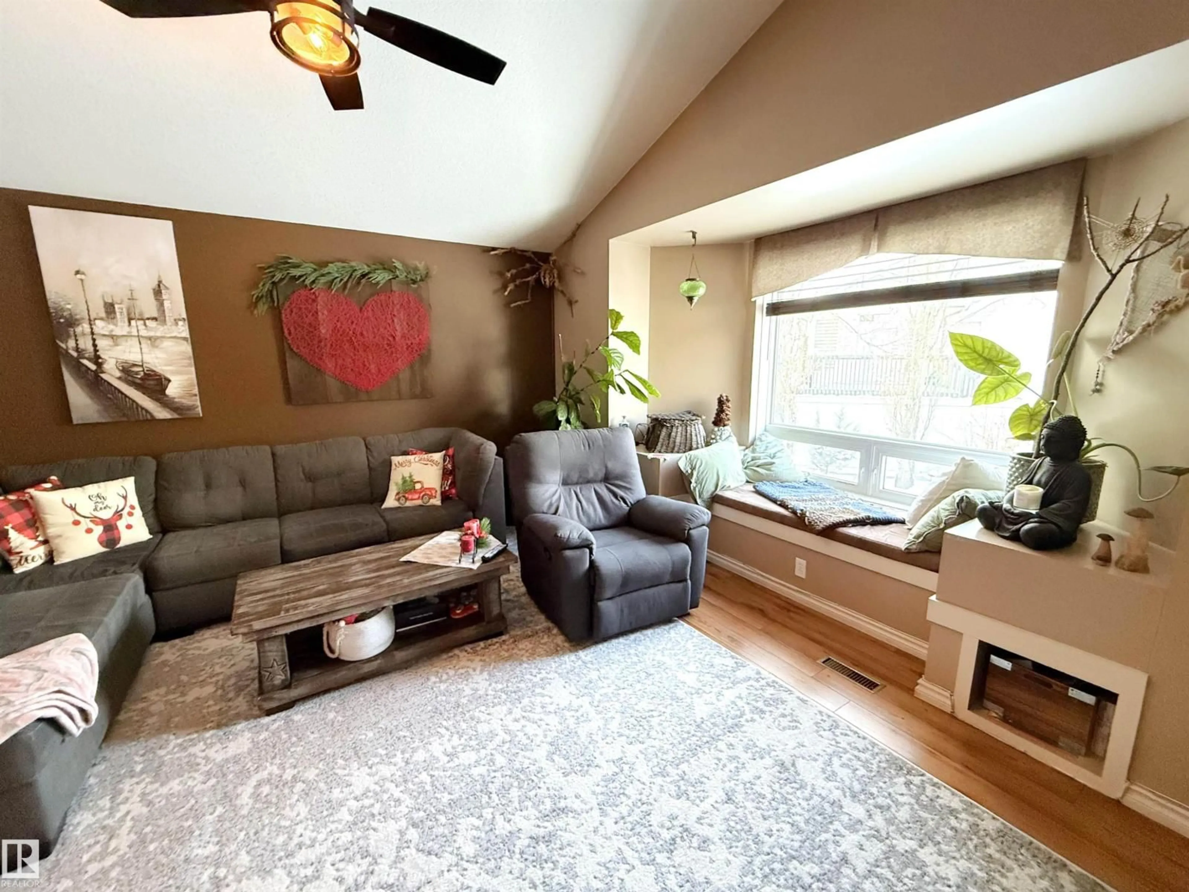 Living room with furniture, wood/laminate floor for 62 WILLOWBY CL, Stony Plain Alberta T7Z2X5