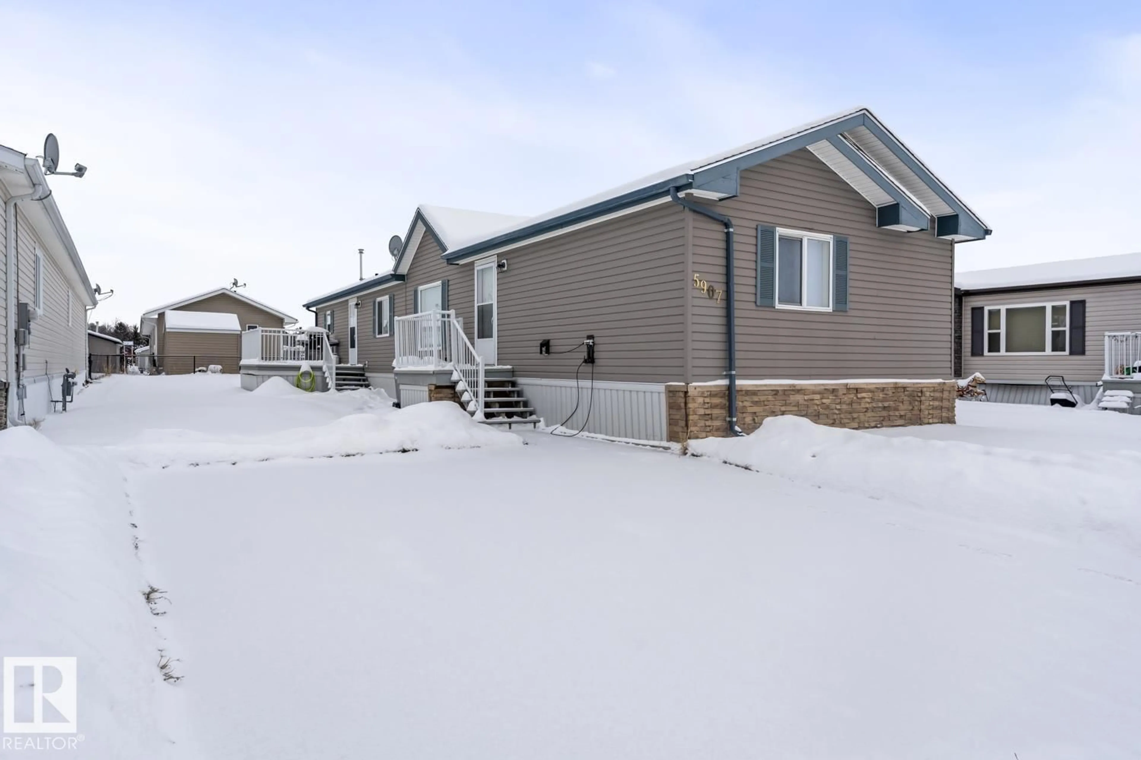 Home with vinyl exterior material, street for 5907 LABRADOR RD, Cold Lake Alberta T9M0C6