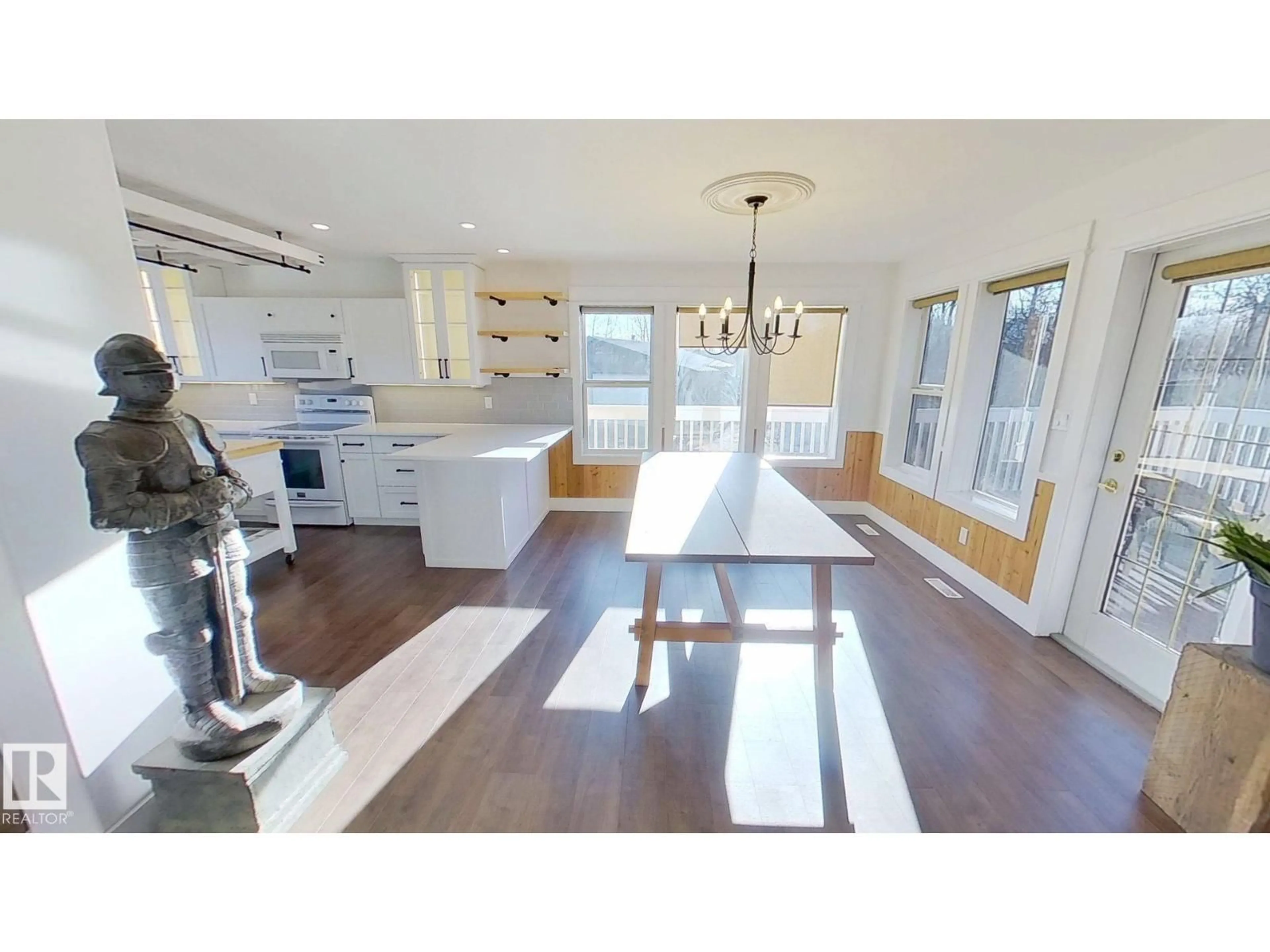 Open concept kitchen, wood/laminate floor for 120 50434 RGE RD 232, Rural Leduc County Alberta T4X0L1