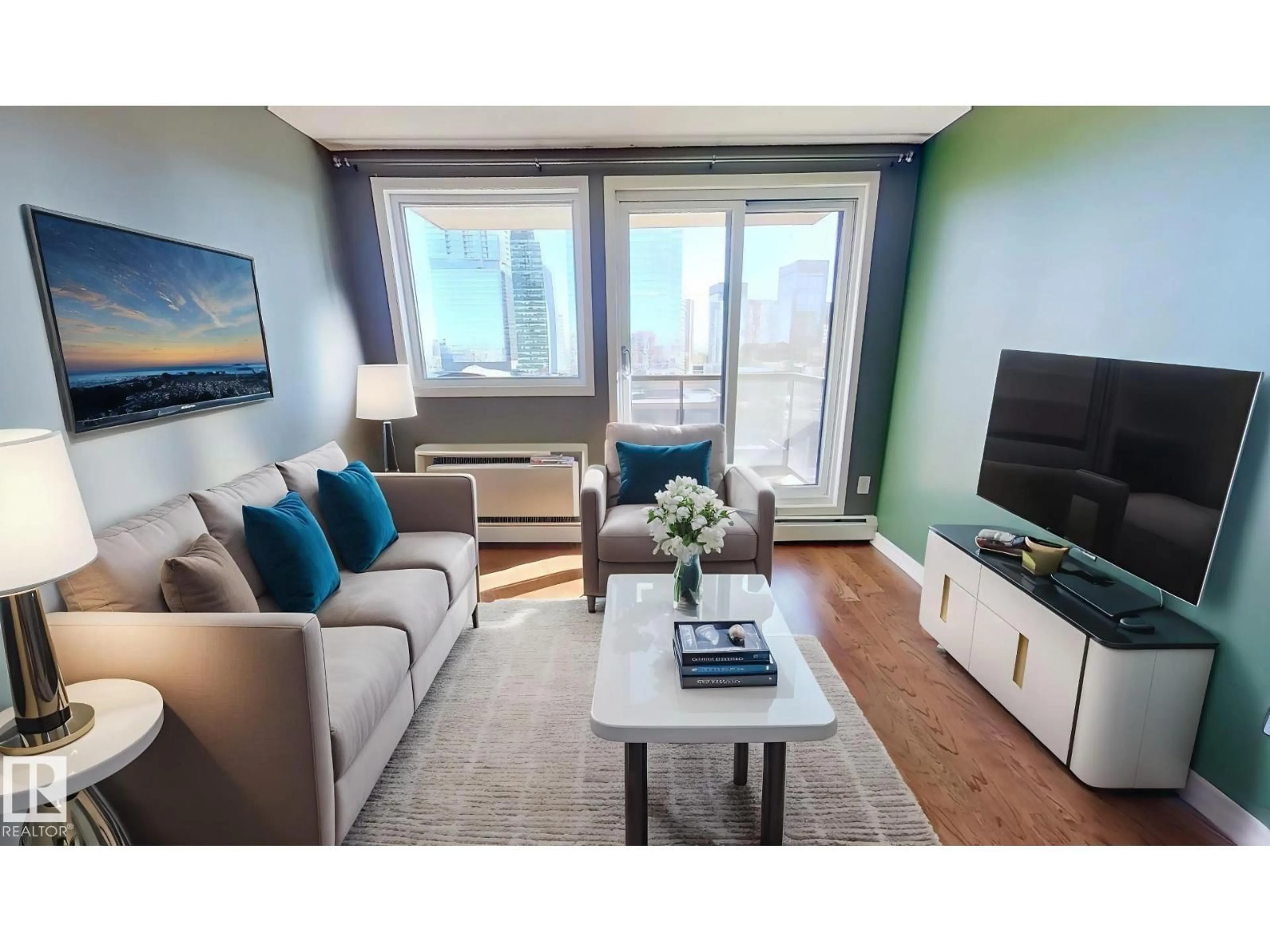 Living room with furniture, wood/laminate floor for 1604 105 ST NW, Edmonton Alberta T5J5G3