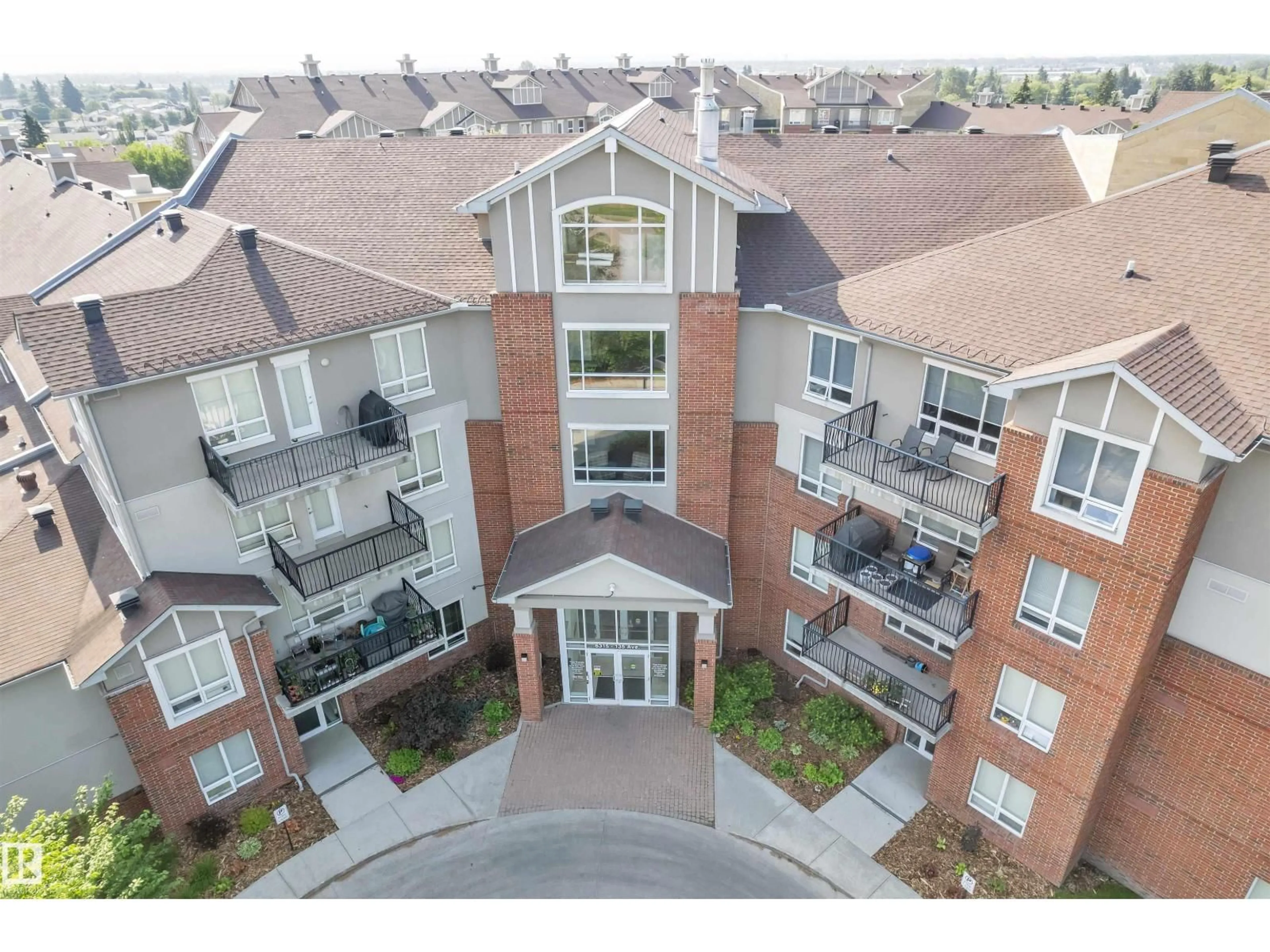A pic from outside/outdoor area/front of a property/back of a property/a pic from drone, mountain view for #104 - 6315 135 AVENUE, Edmonton Alberta T5A5J7