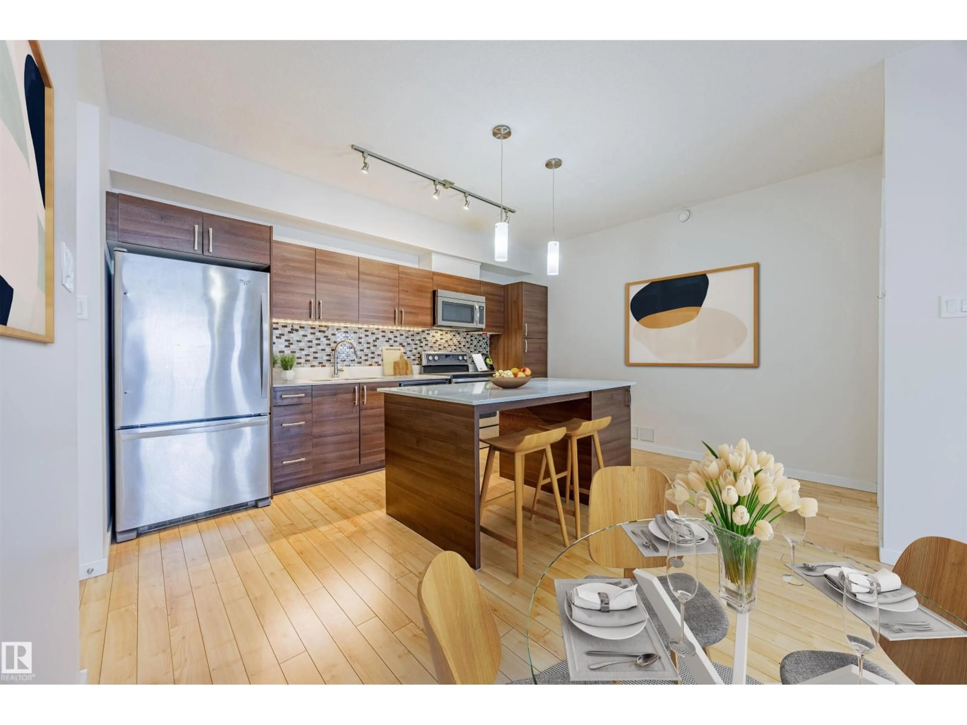 Open concept kitchen, wood/laminate floor for #409 - 9517 160 AV, Edmonton Alberta T5Z0N1