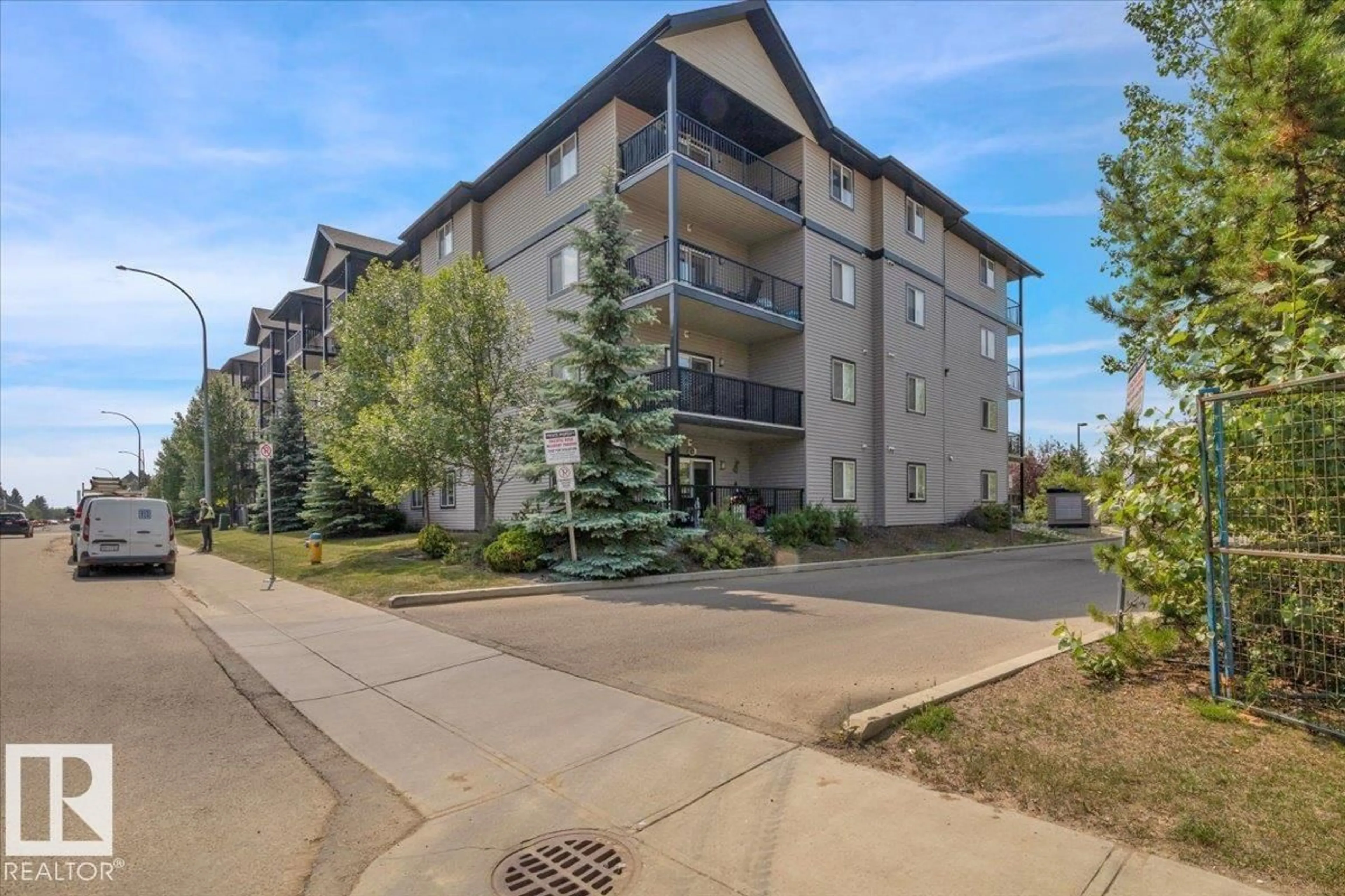 A pic from outside/outdoor area/front of a property/back of a property/a pic from drone, street for 219 14808 125 ST NW, Edmonton Alberta T5X0G1