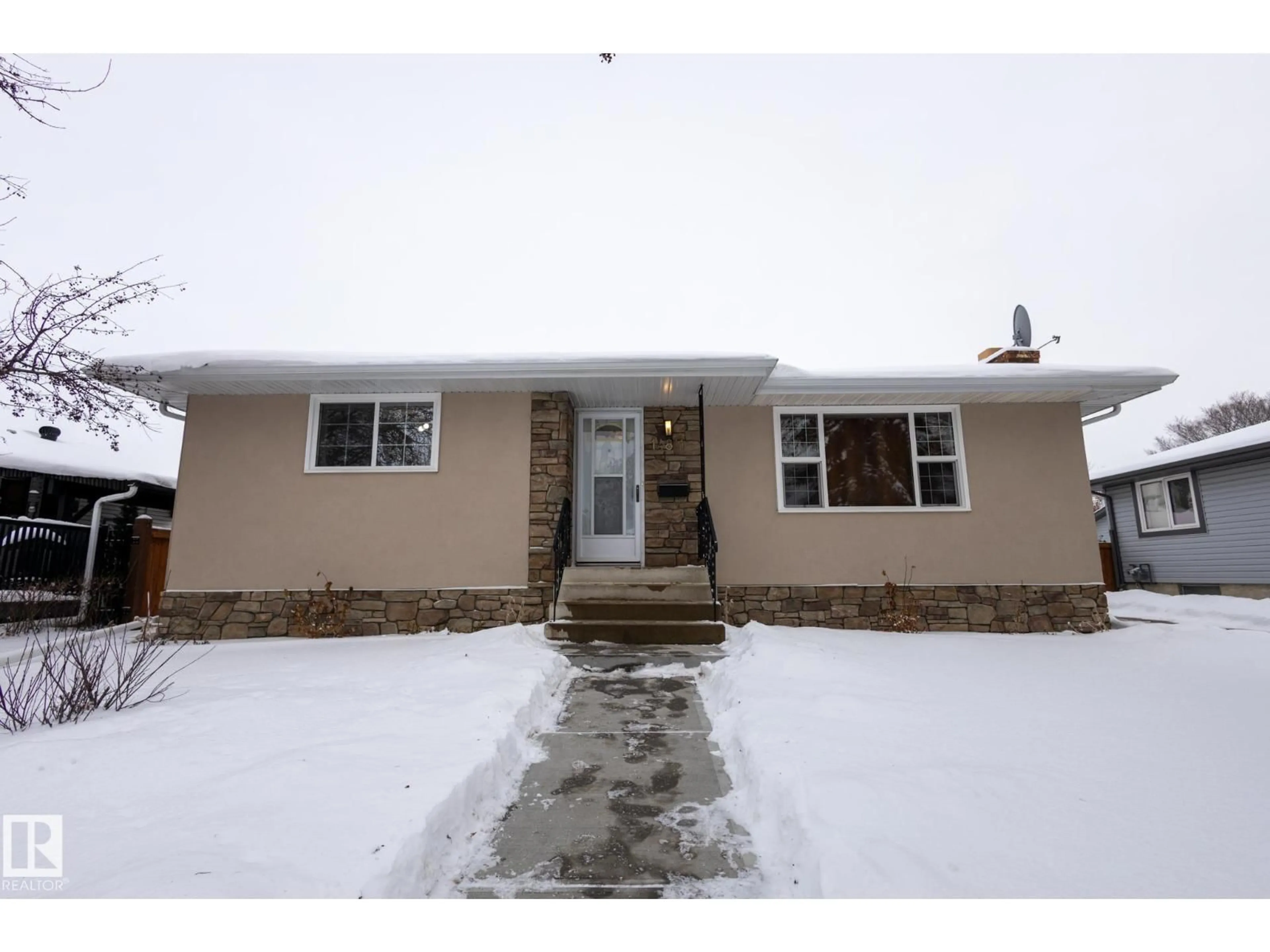 Home with vinyl exterior material, street for 14811 61A ST NW, Edmonton Alberta T5A2A7