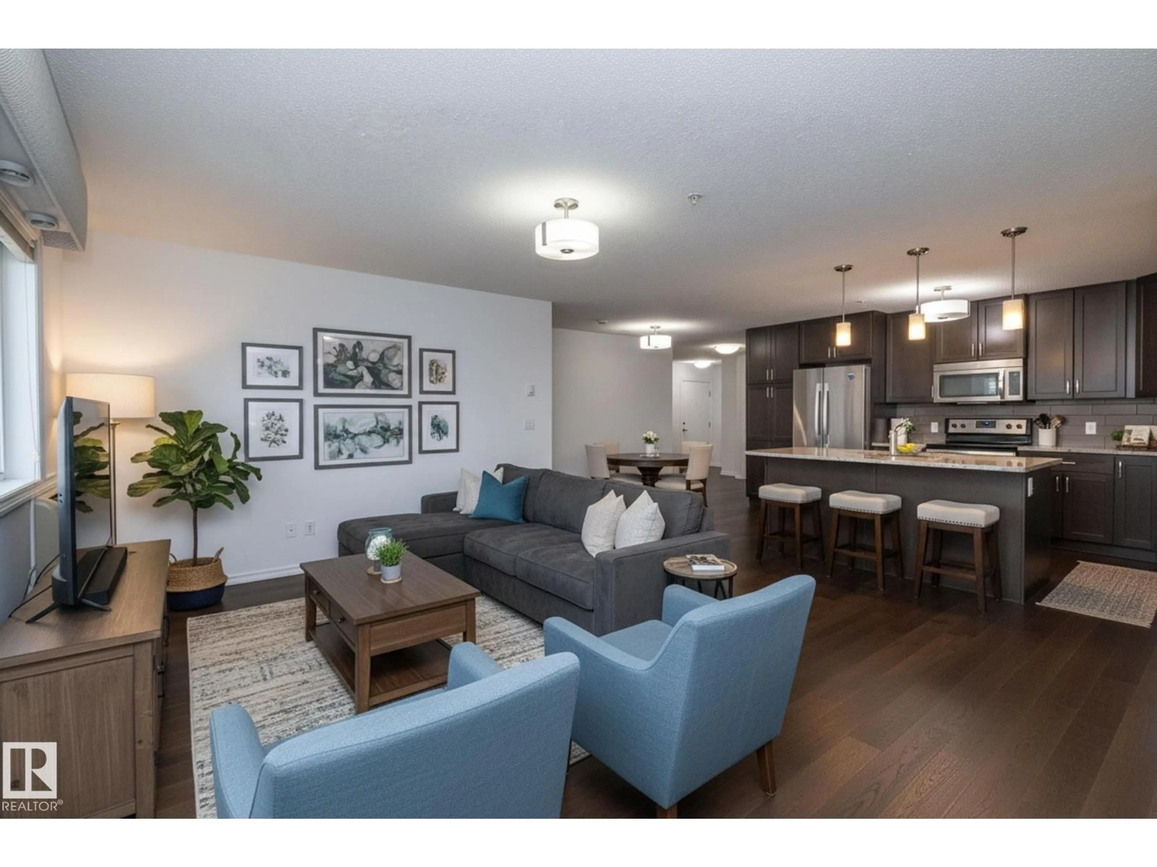 Living room with furniture, wood/laminate floor for #102 - 2203 44 AV, Edmonton Alberta T6T0T1