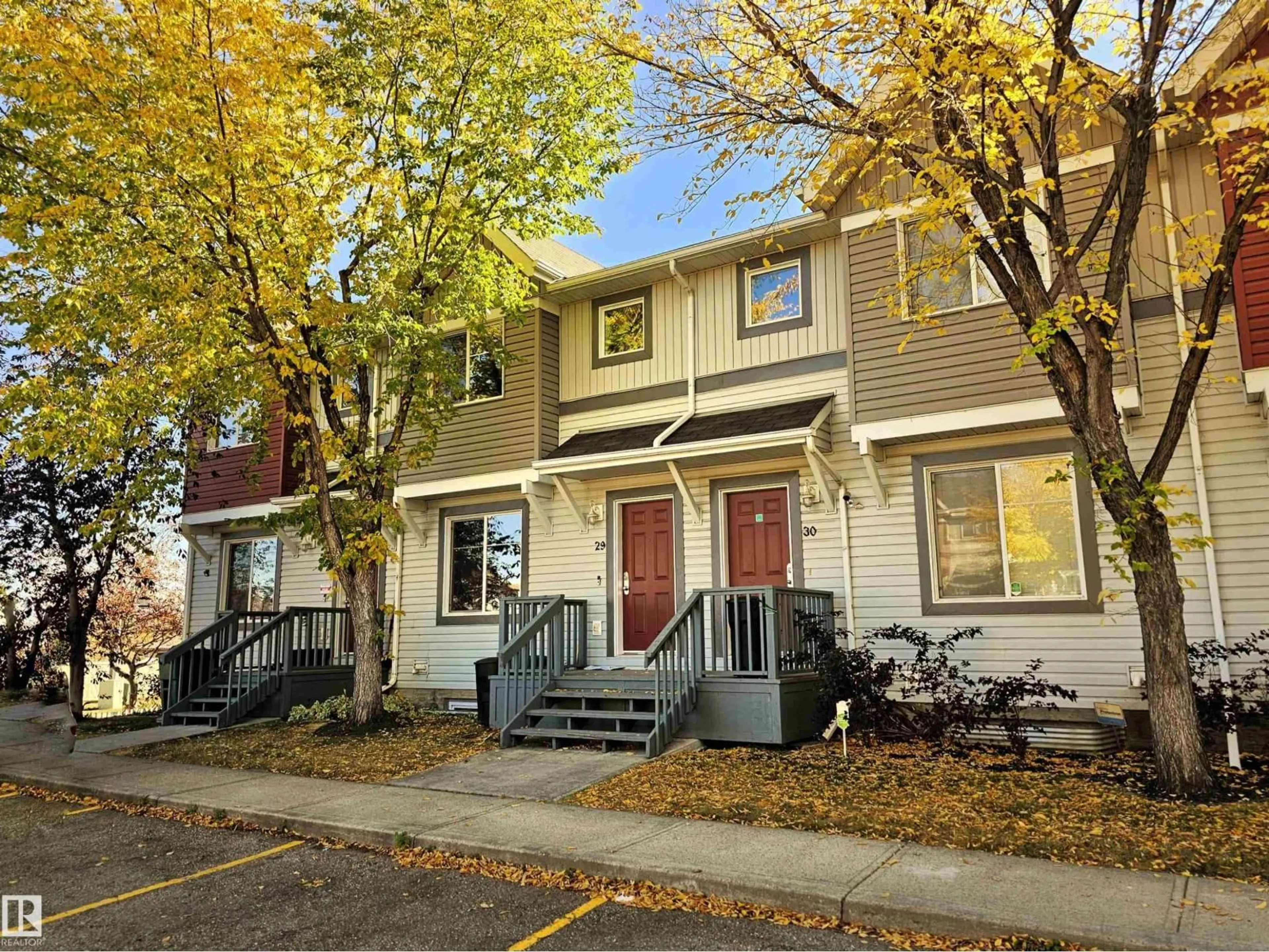 Home with vinyl exterior material, street for 1404 - 29 HERMITAGE RD, Edmonton Alberta T5A0P5