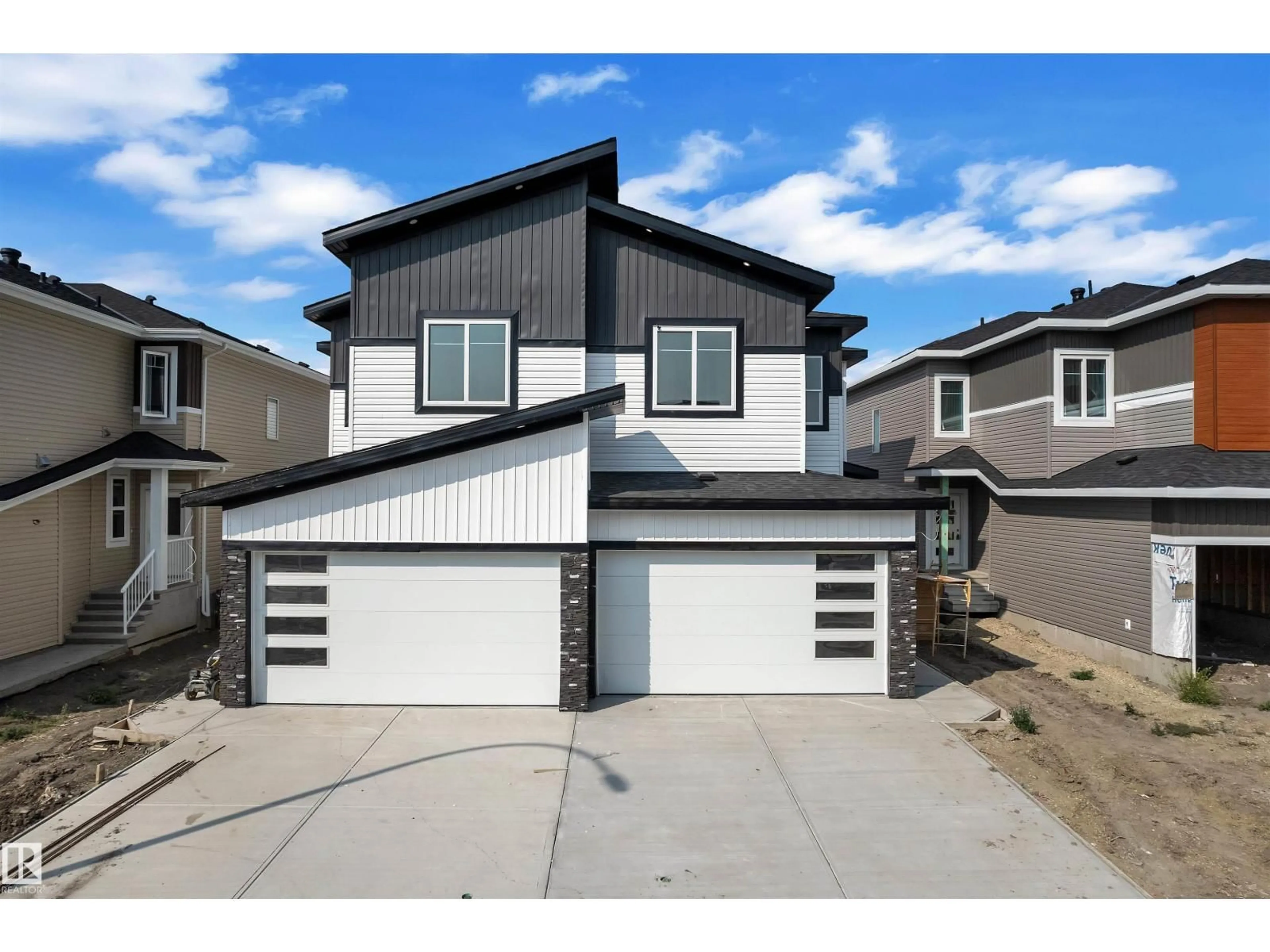 Home with vinyl exterior material, street for NW - 1914 155 AV, Edmonton Alberta T5Y4H8